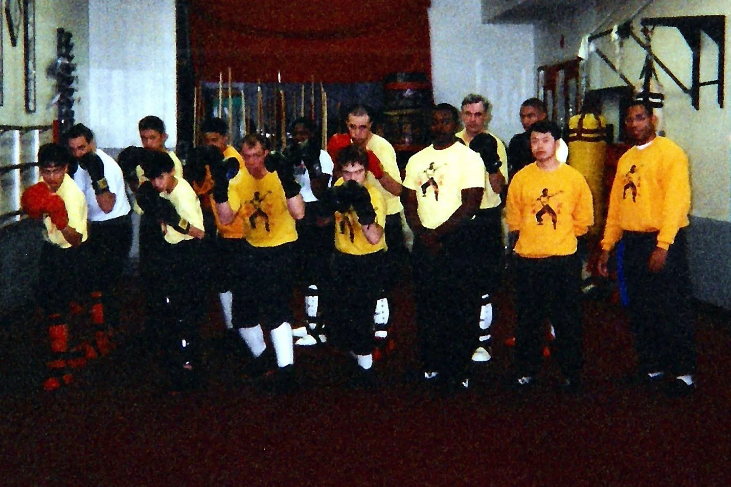 James Whitley III and his classmates in sparring gear at a kung fu sparring class