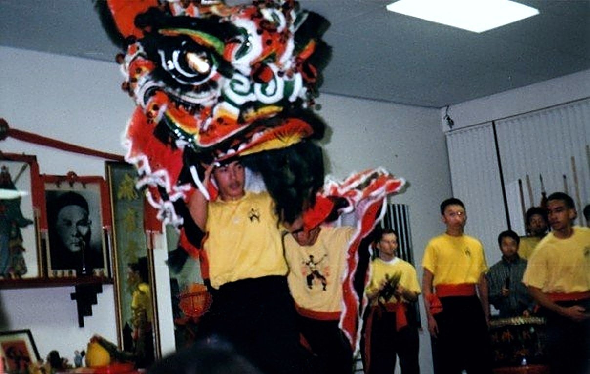James Whitley III performing a traditional Chinese lion dance with his kung fu classmates