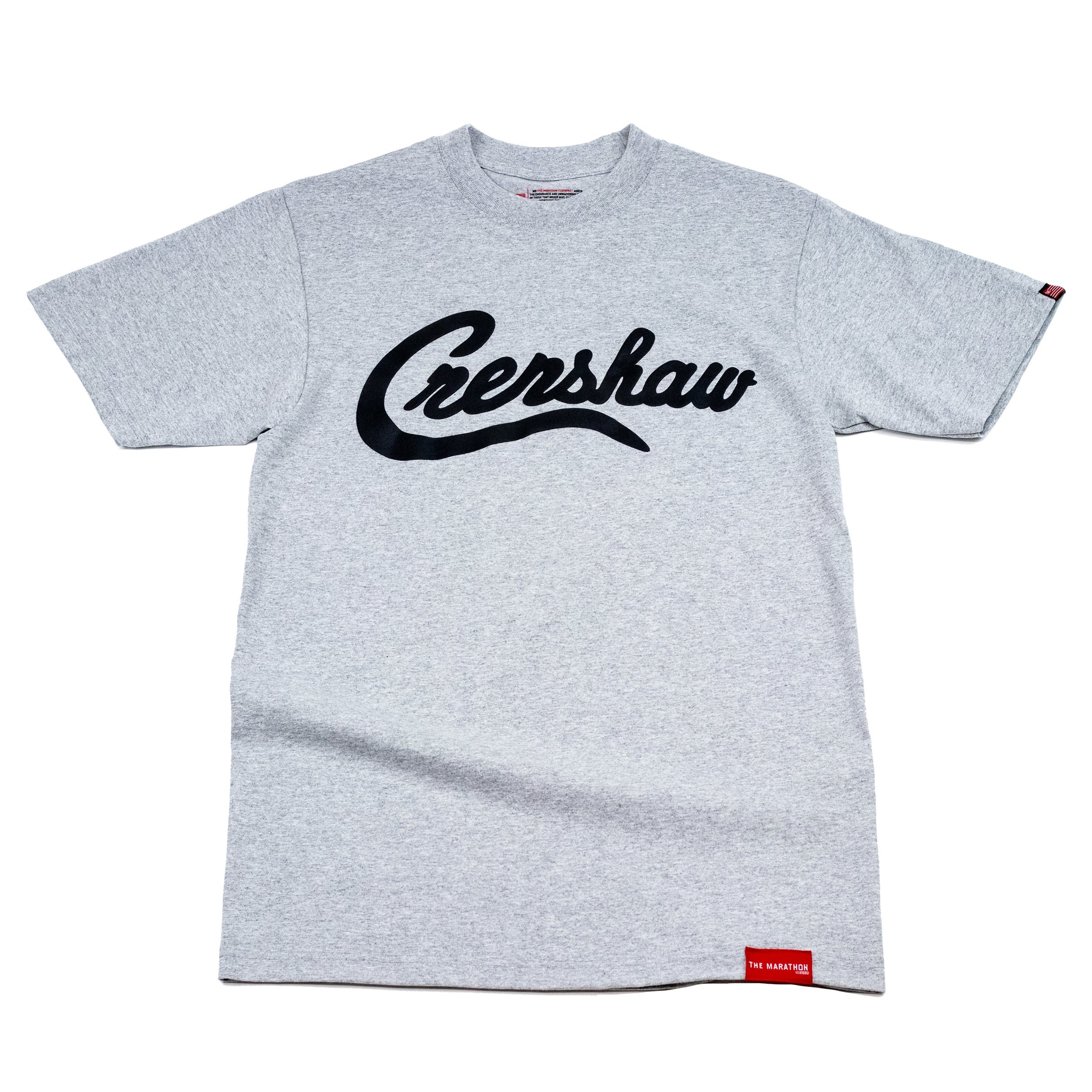 Gray T-shirt with black cursive logo 'Creshtow' across the front and a small red tag near the bottom hem.