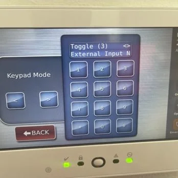 Touchscreen control panel displaying a numeric keypad and “External Input” menu