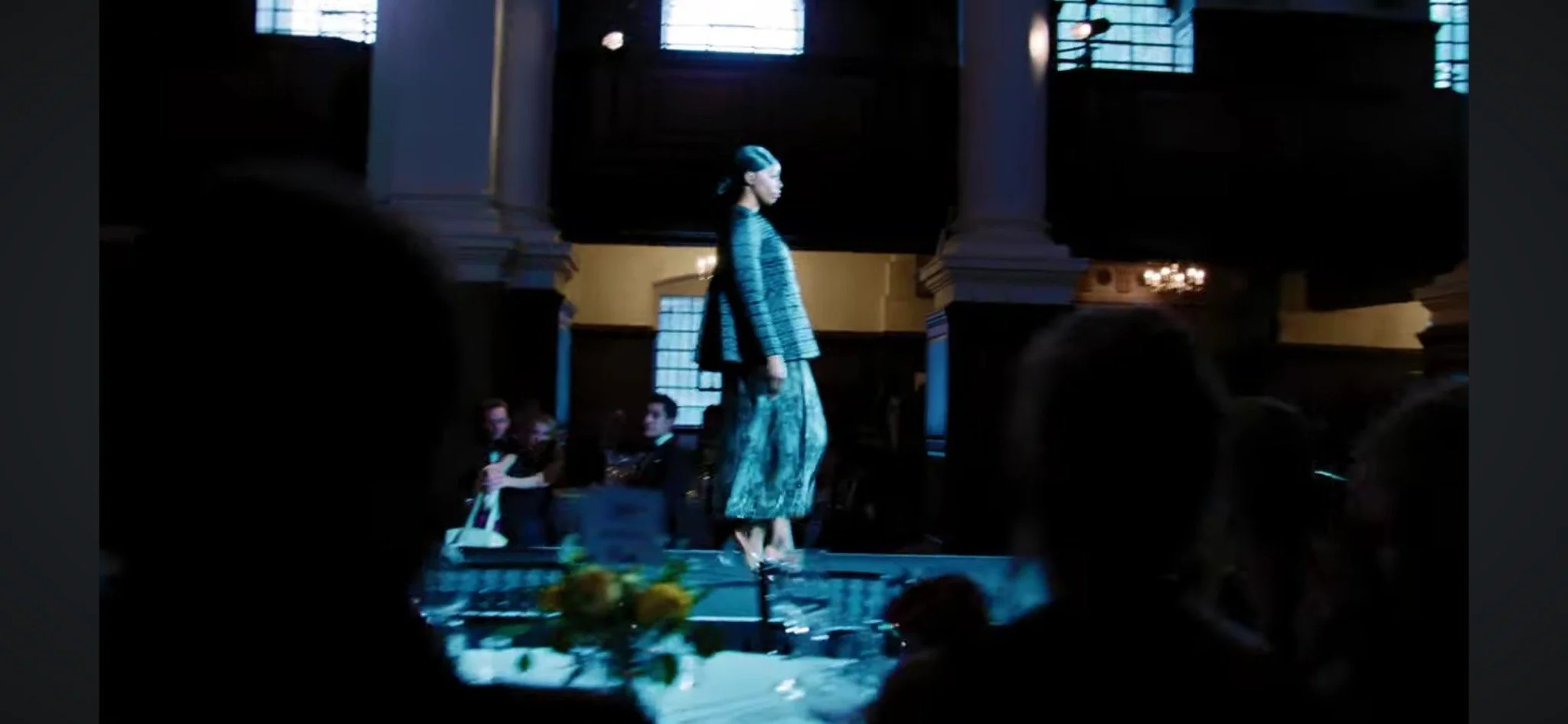 Model walking the runway in the Nave at Christ Church Spitalfields.