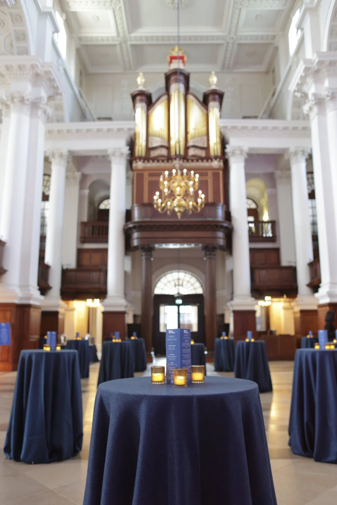 Poseur tables arranged for a drinks reception in the Nave.