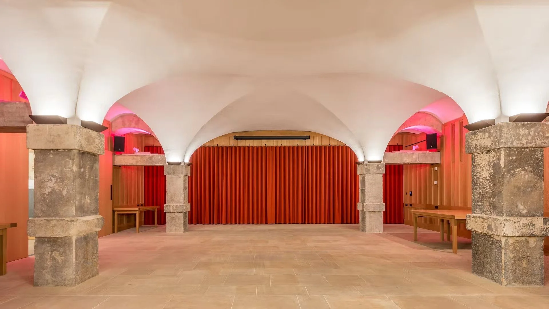 Vaulted ceiling, stone columns and open floor space in the Crypt.