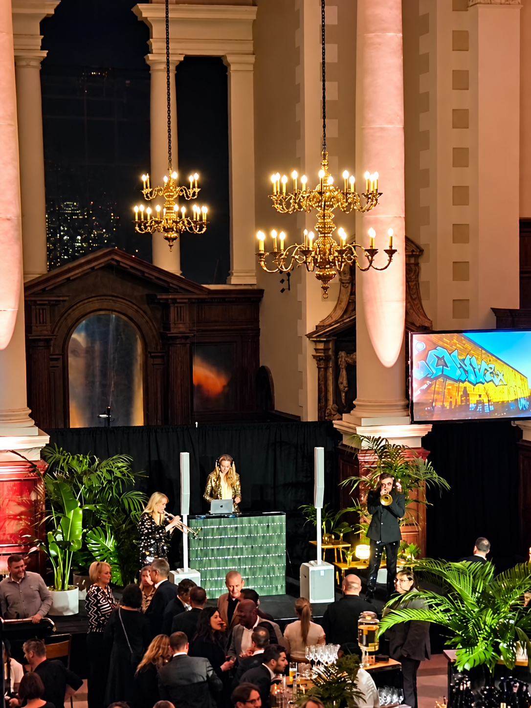 DJ and musicians performing for dinner guests in the Nave