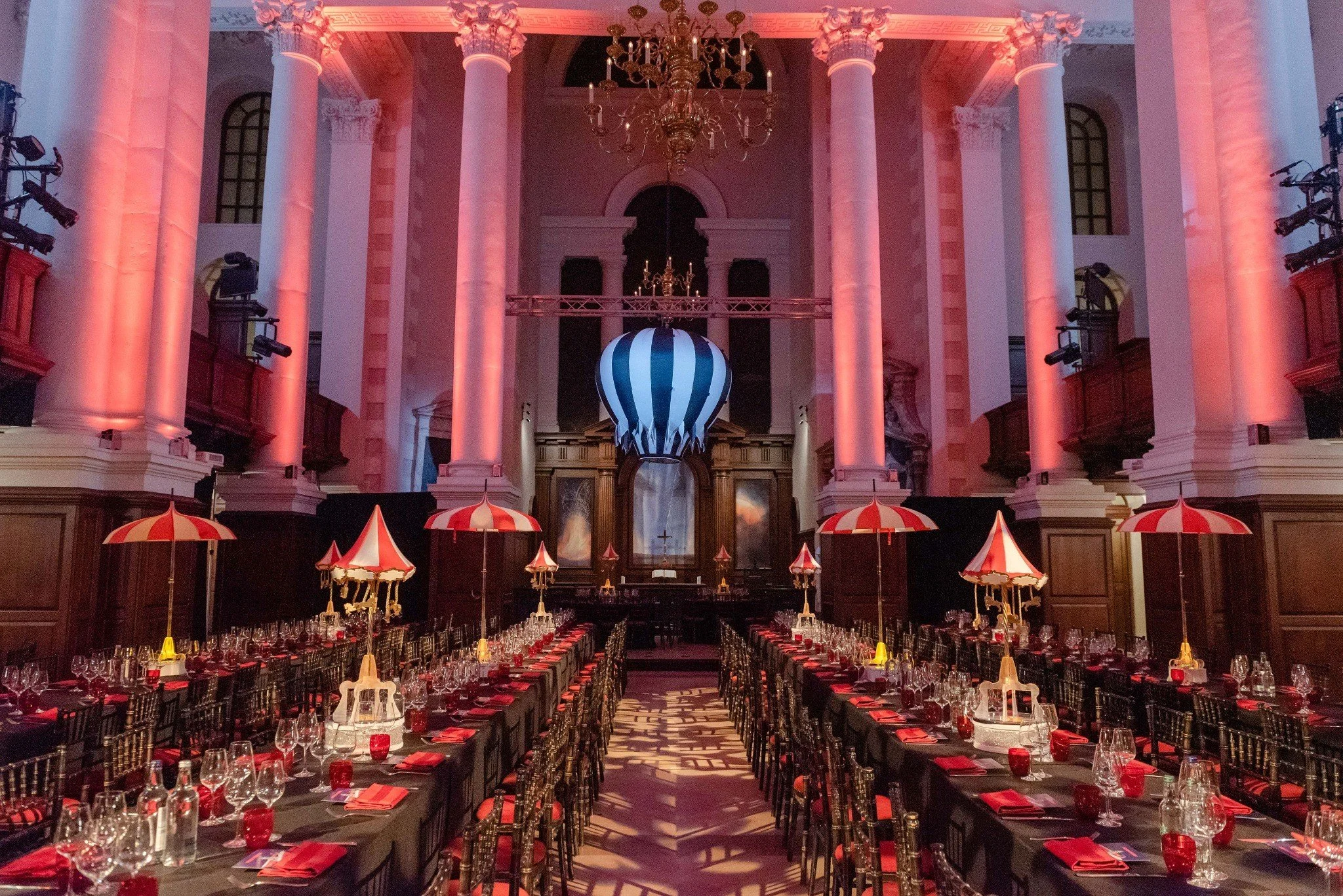 The Nave dressed with themed table decorations and lighting for a gala dinner.