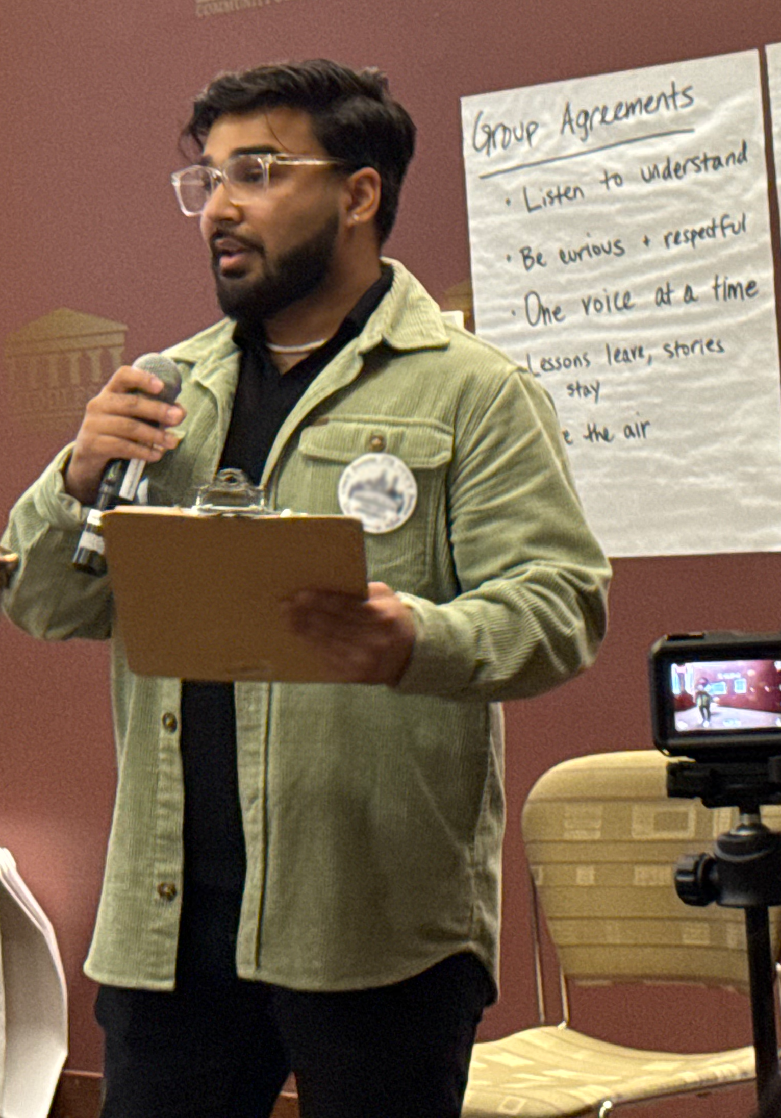 Zuhair speaking at an event