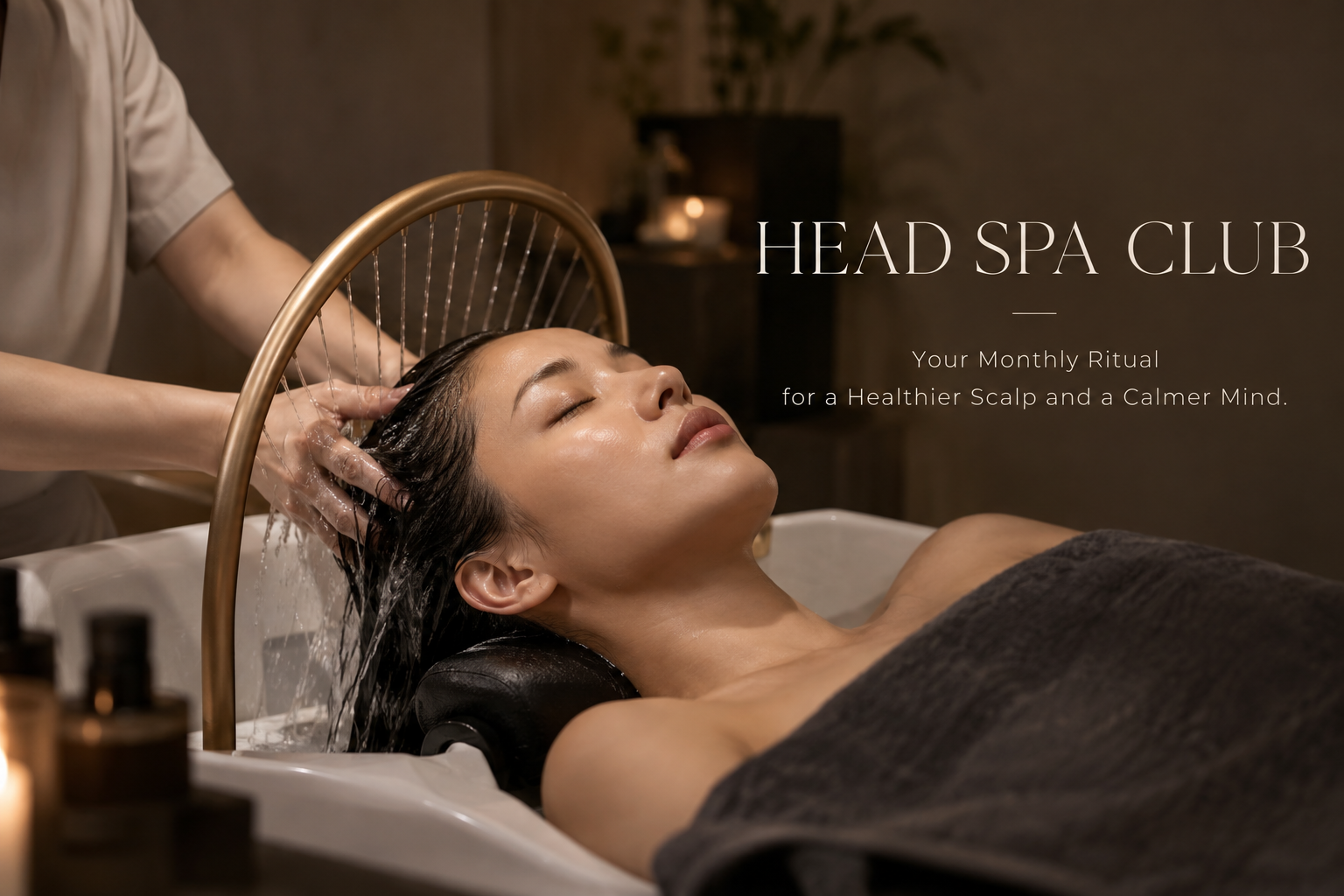 A woman enjoying a relaxing head spa treatment with a gentle scalp massage and water therapy.