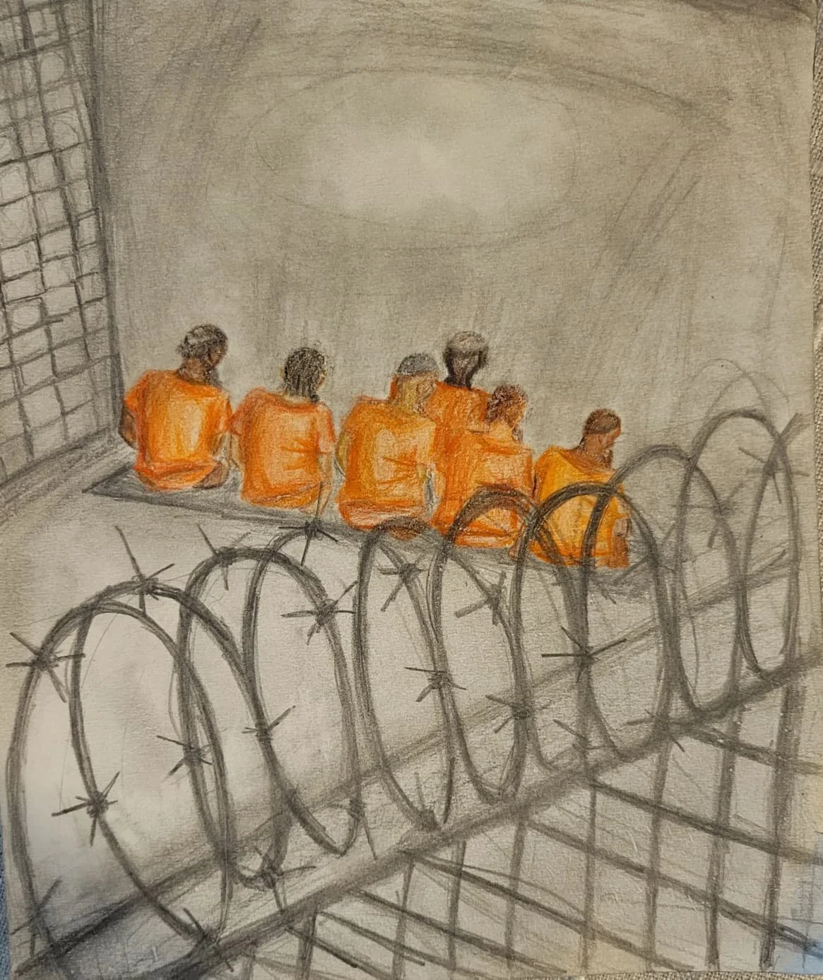 Artwork created by child of a political prisoner. Sketch of incarcerated people in orange uniforms sitting behind barbed wire and a chain-link fence
