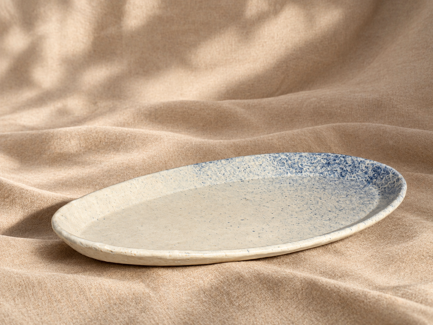 Speckled Ceramic Platter on Linen.png