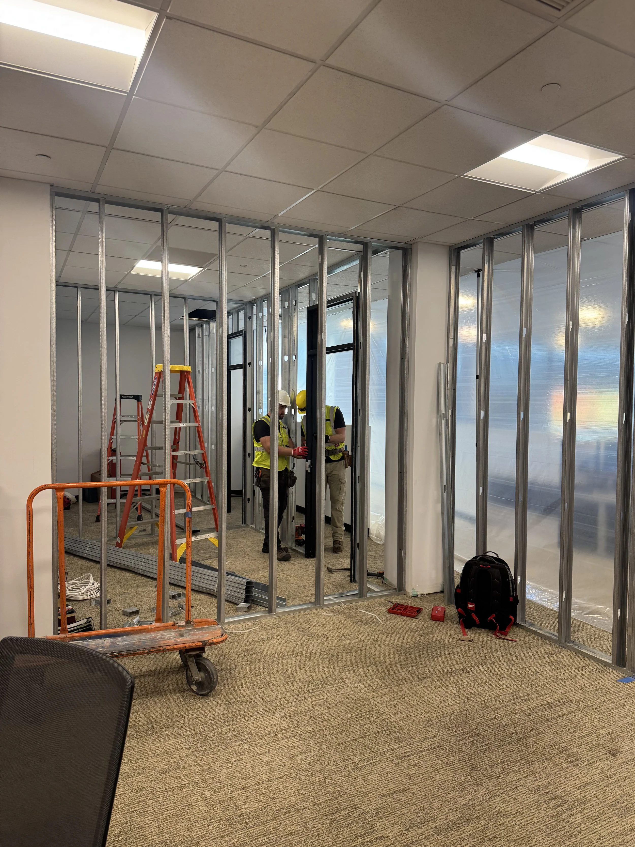 Corporate office build-out in progres,  metal stud framing and glass partions