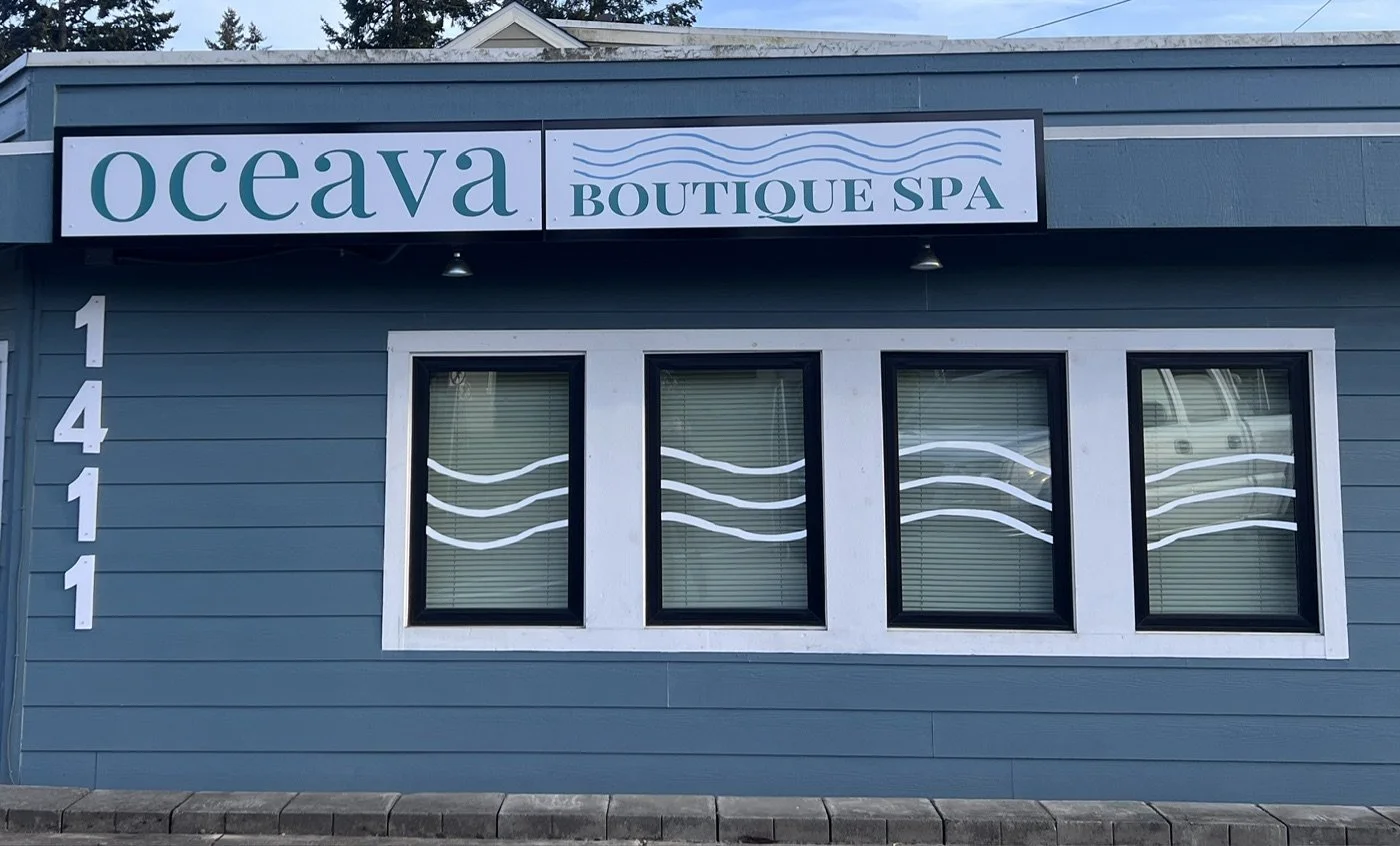Vinyl signage above, window graphics, and 3D building numbers. 