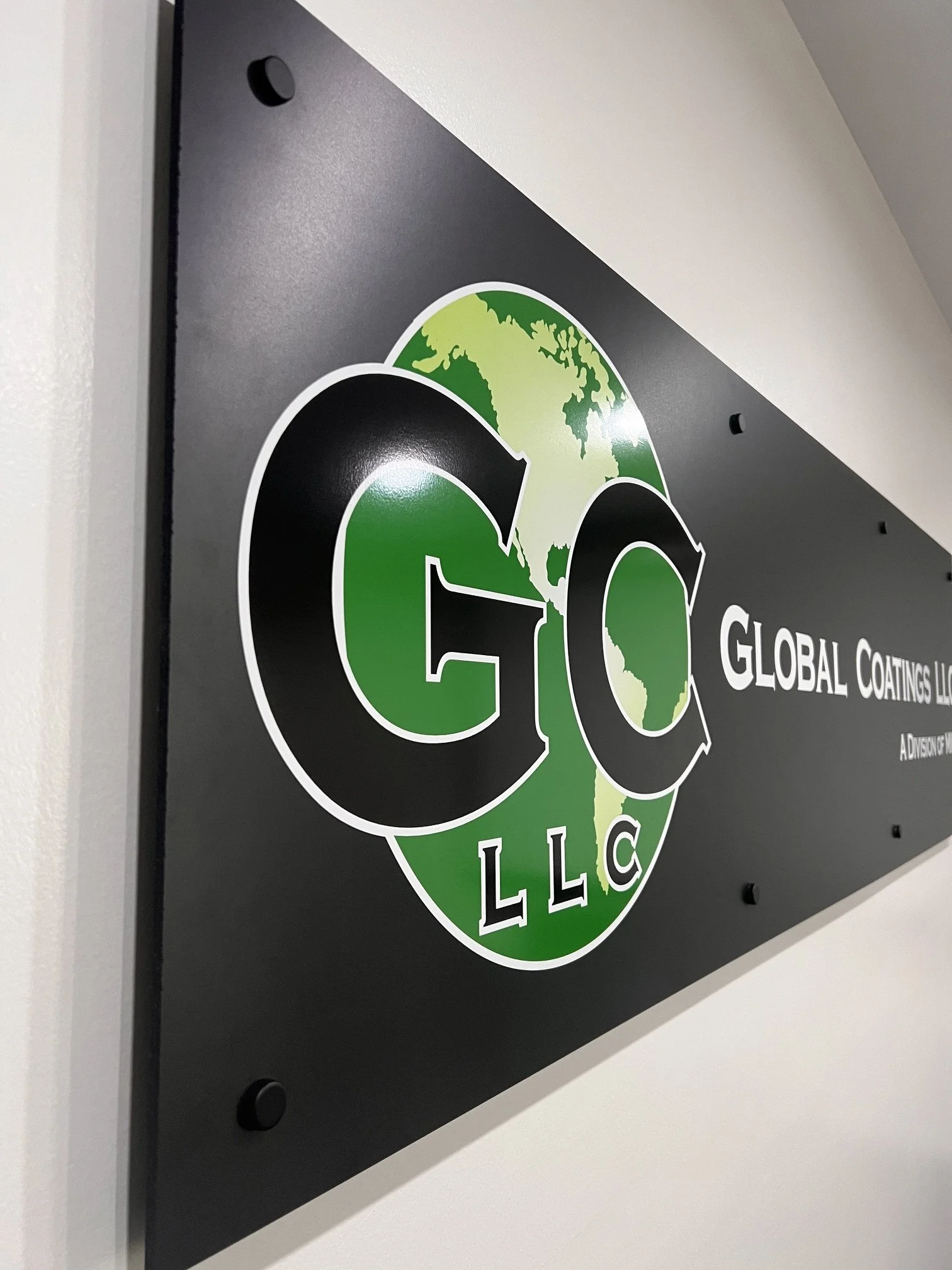 Black substrate with printed graphics and black stand offs.  