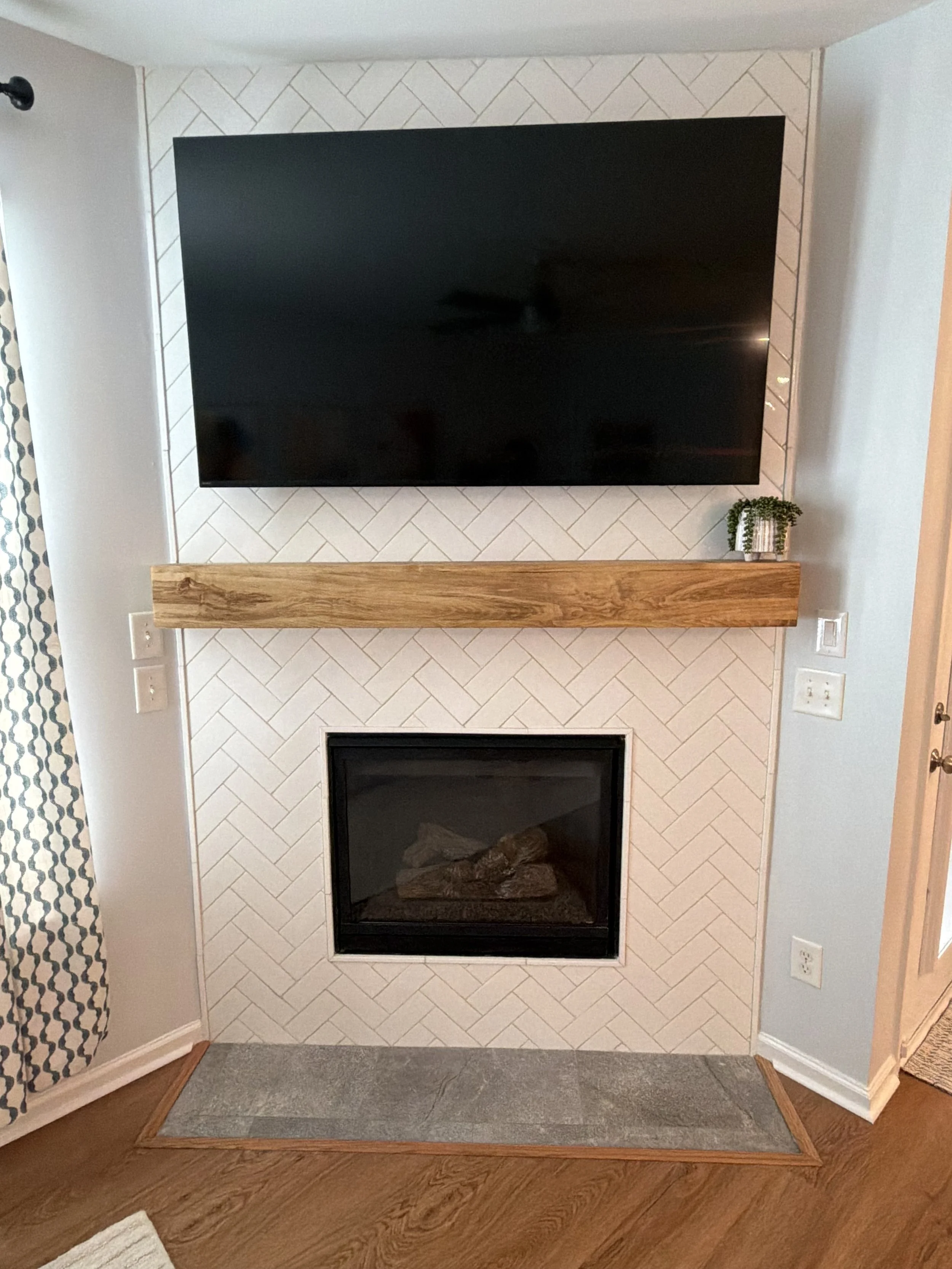 White herringbone tile and a warm