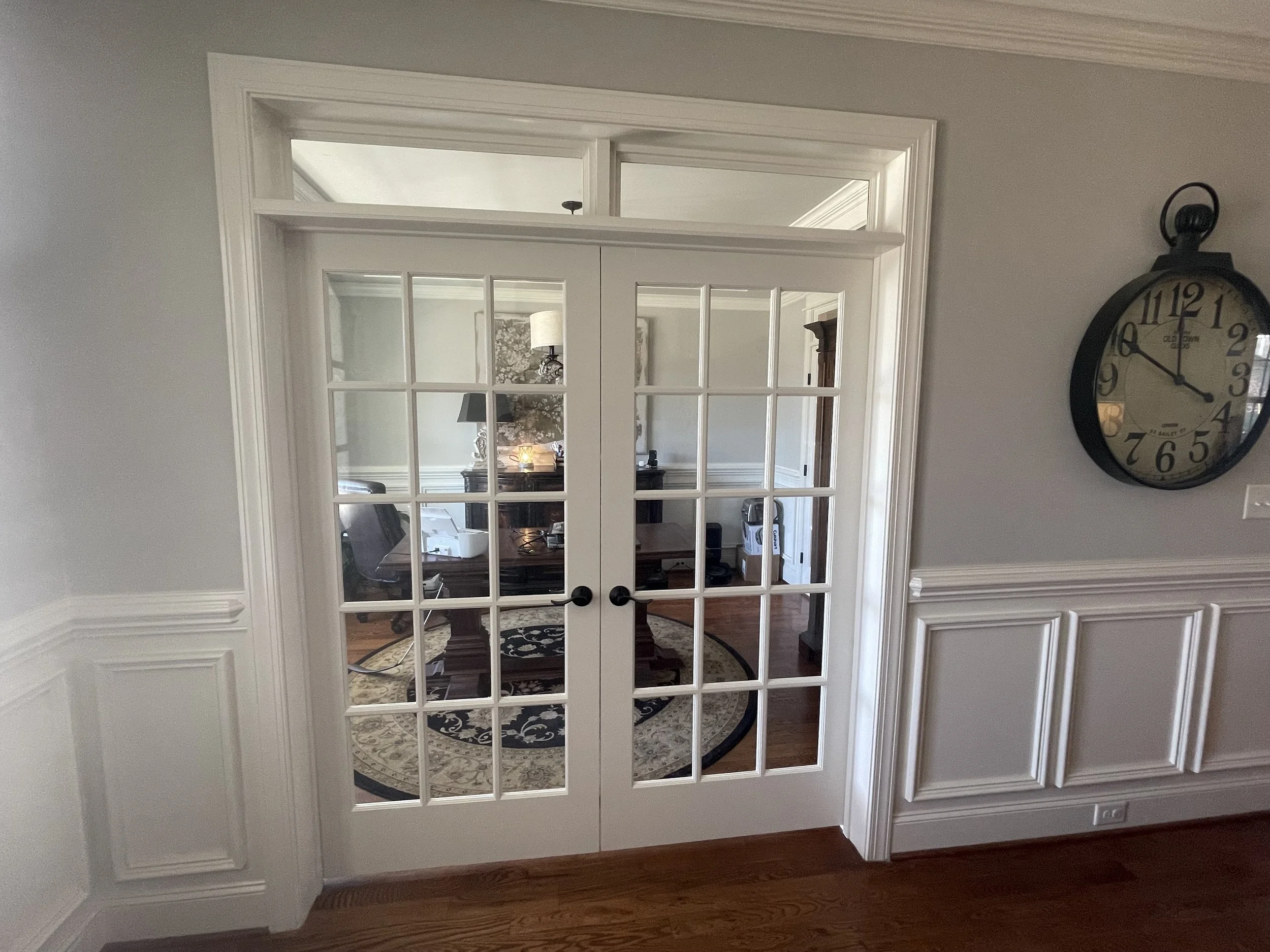 Glass French doors create a little separation while keeping the light and the connection between rooms.