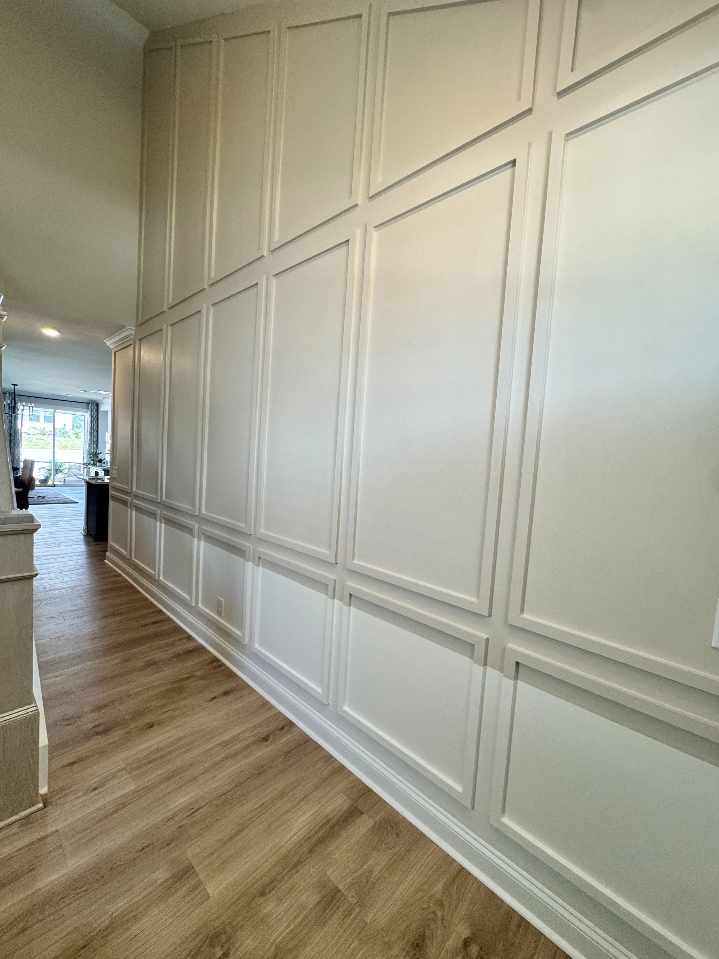 Classic wall molding adds depth and character to this hallway, turning a simple pass-through into a thoughtful part of the home.