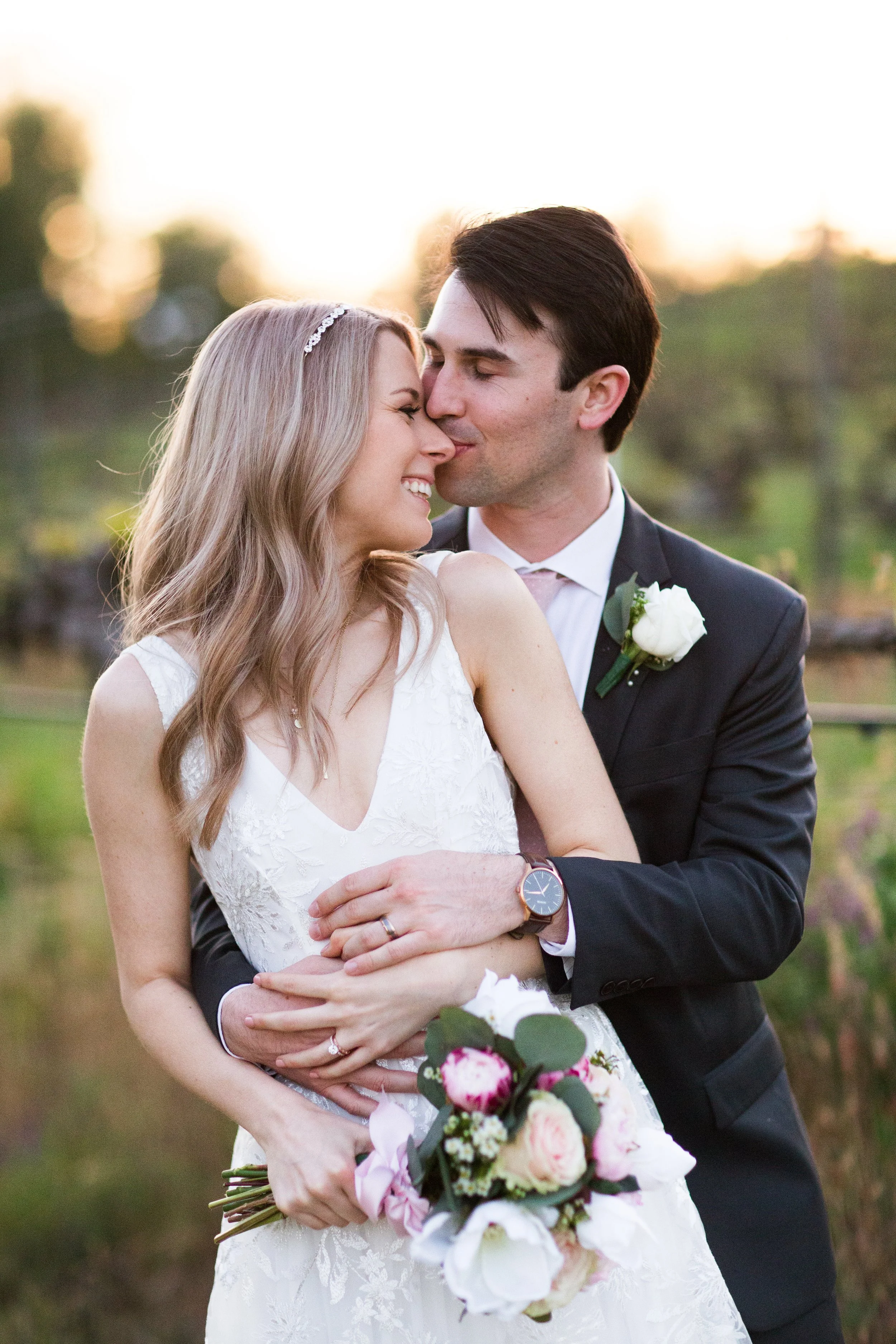 Wedding day embrace photo by Dr. John Jiao
