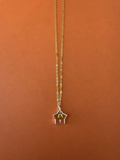SIiver Star Pendant with Gold Toned Star Accent