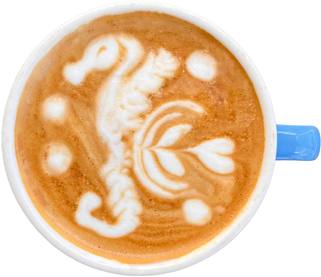 Top-down view of a sea horse latte art in a cup with blue handle.