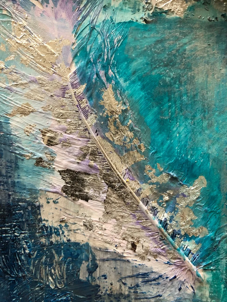 Close-up of a textured abstract painting with blue, white, and gold colors, featuring a feather-like design with layered, textured paint strokes.