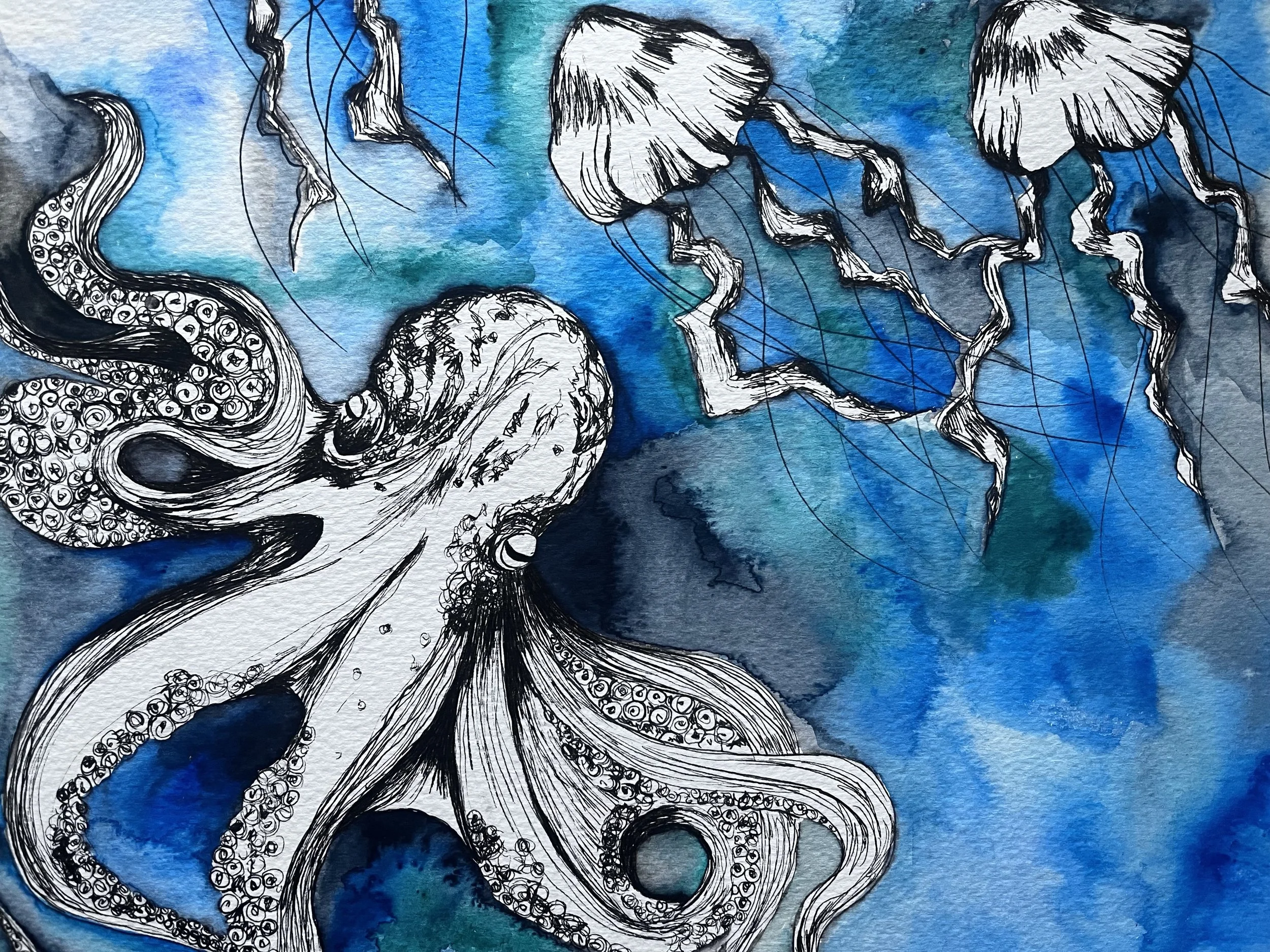 A black and white ink drawing of an octopus and jellyfish over a watercolor background in shades of blue.