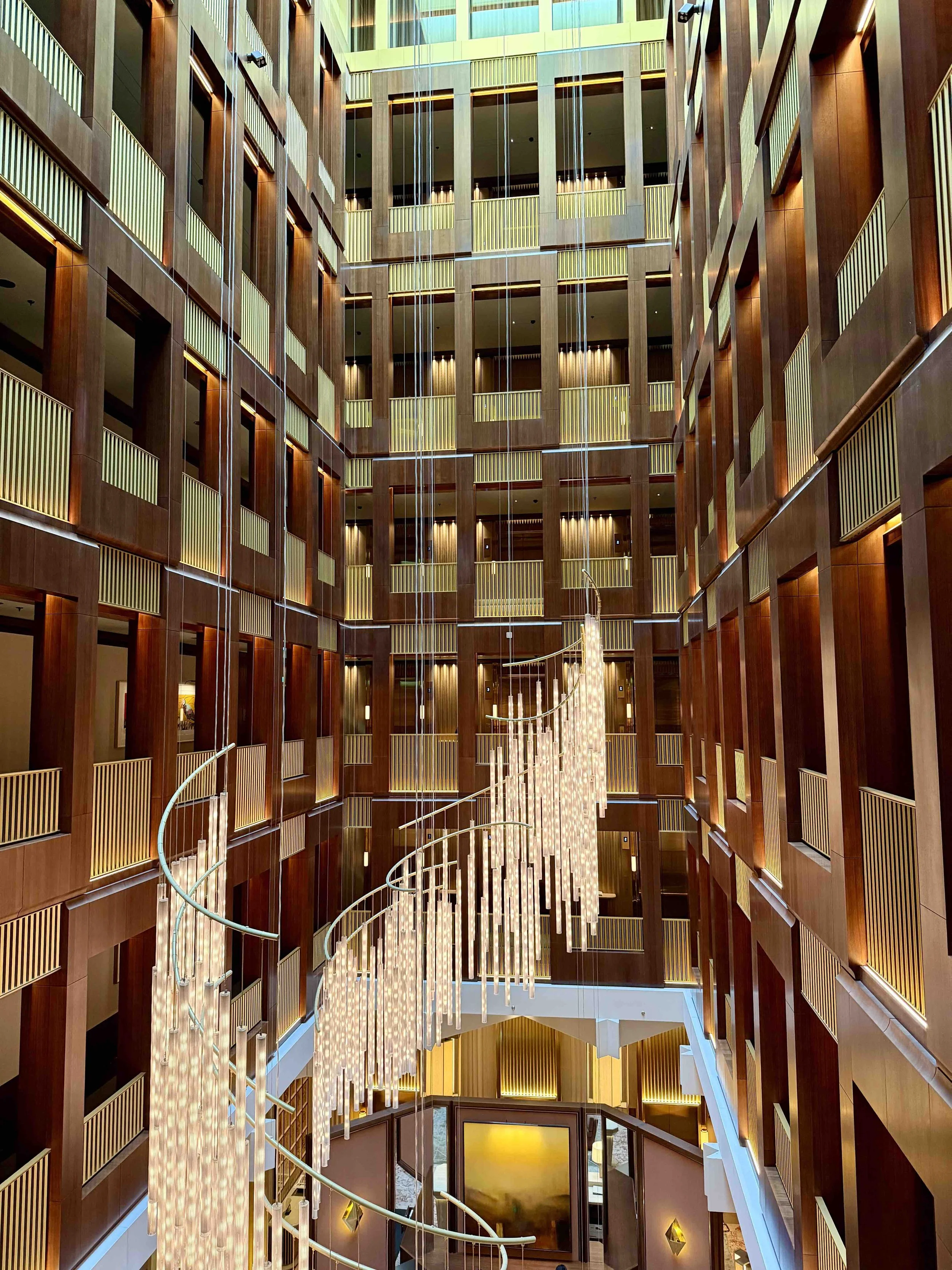 Dramatic central atrium and chandelier inside The Chancery Rosewood in Mayfair.