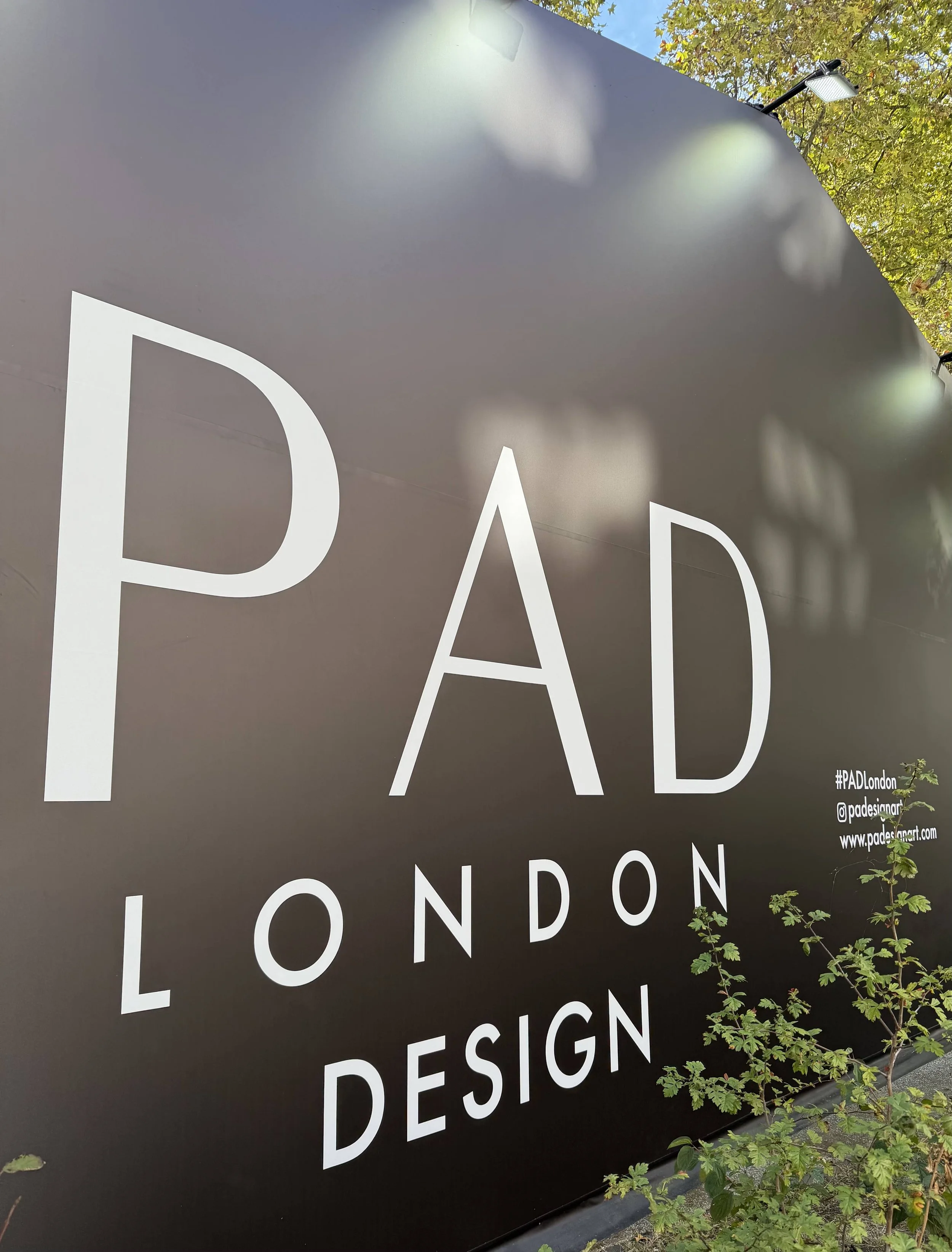PAD London design fair sign outside the pavilion in Berkeley Square during Frieze Week 2026.