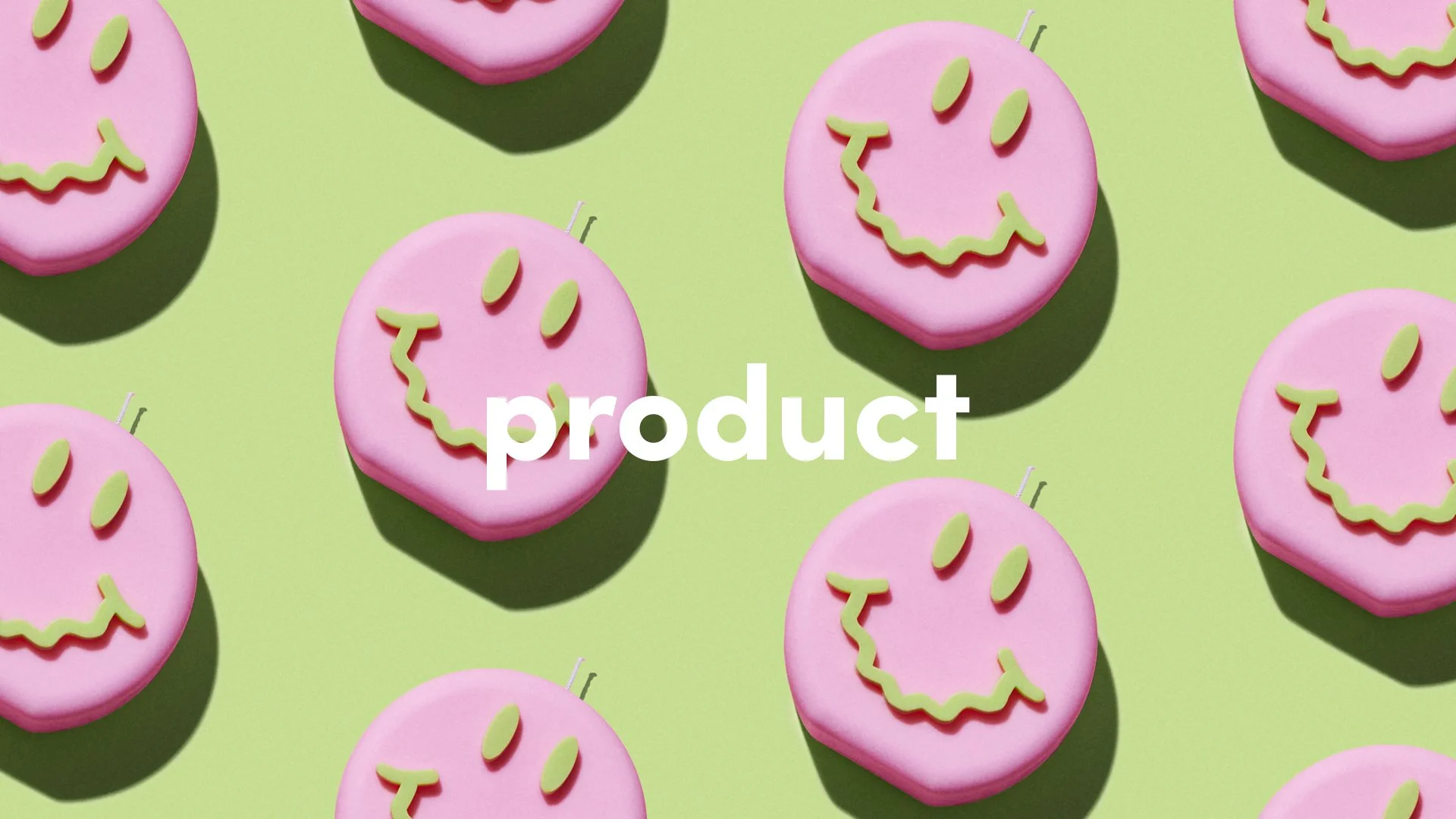 Pink smiley face candles on a lime-green background, overlaid with the word “product.”