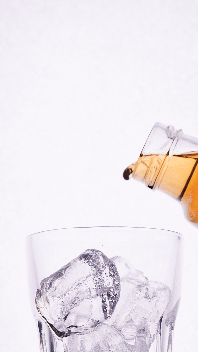 Stop motion GIF of Vapiano Ice Tea drink being poured into a glass filled with ice against a white background.