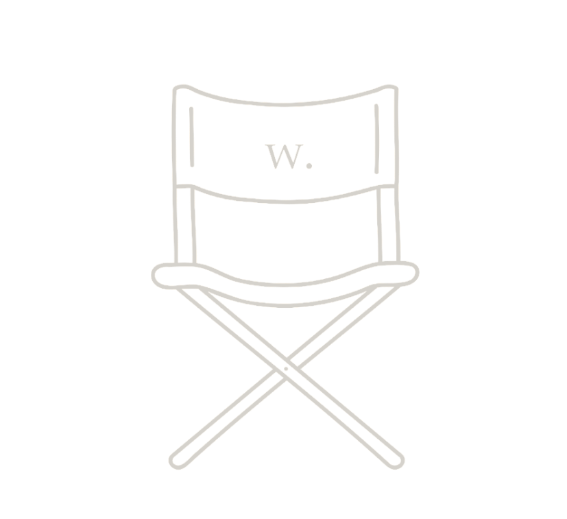 Outline of a director's chair with the letter 'W' on the backrest, against a black background.
