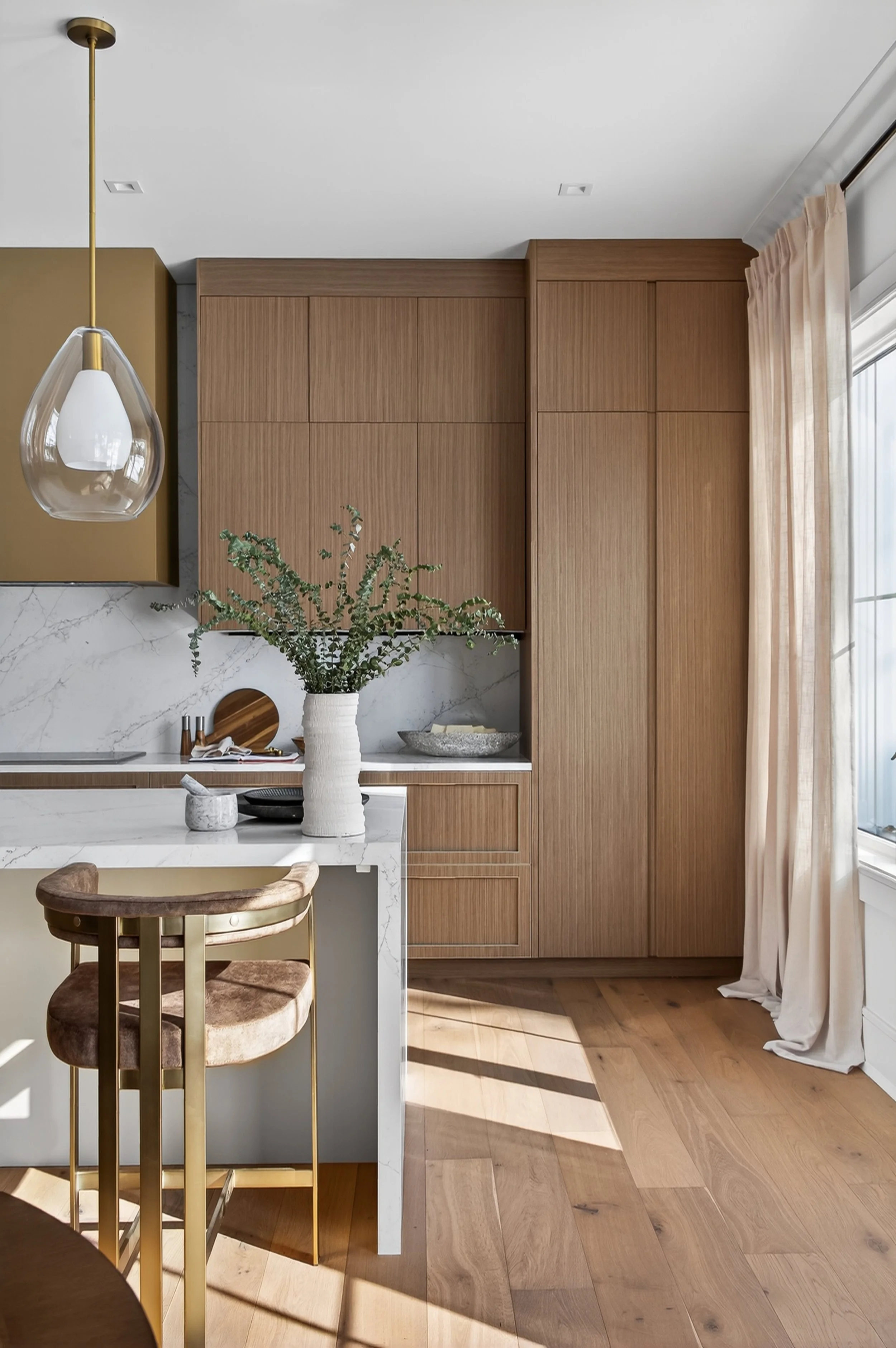 Monarch finish palette kitchen with warm oak cabinetry and marble