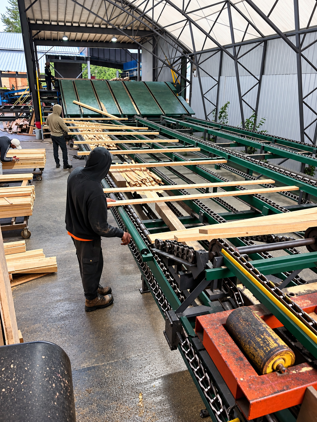 Lumber moving through a processing line inside Morwood Forest Products’ mill.