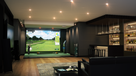 Indoor golf simulation room with a view of an outdoor golf course on a large screen, black walls, and modern furnishings.