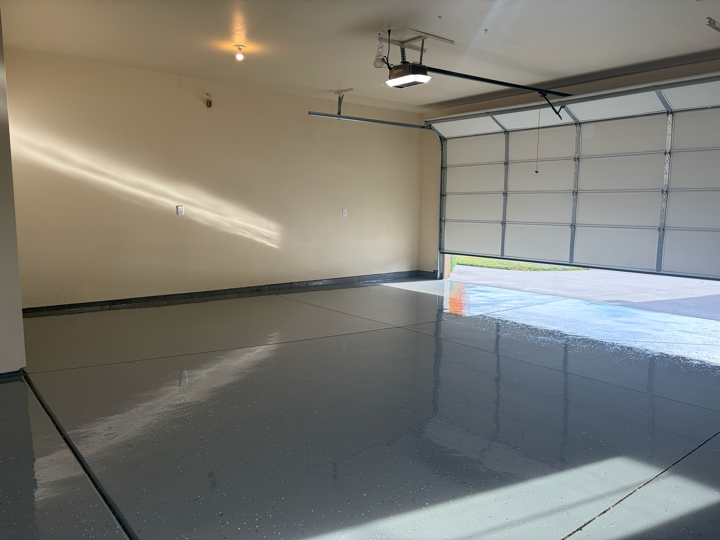 Grey speckle epoxy flooring in a garage