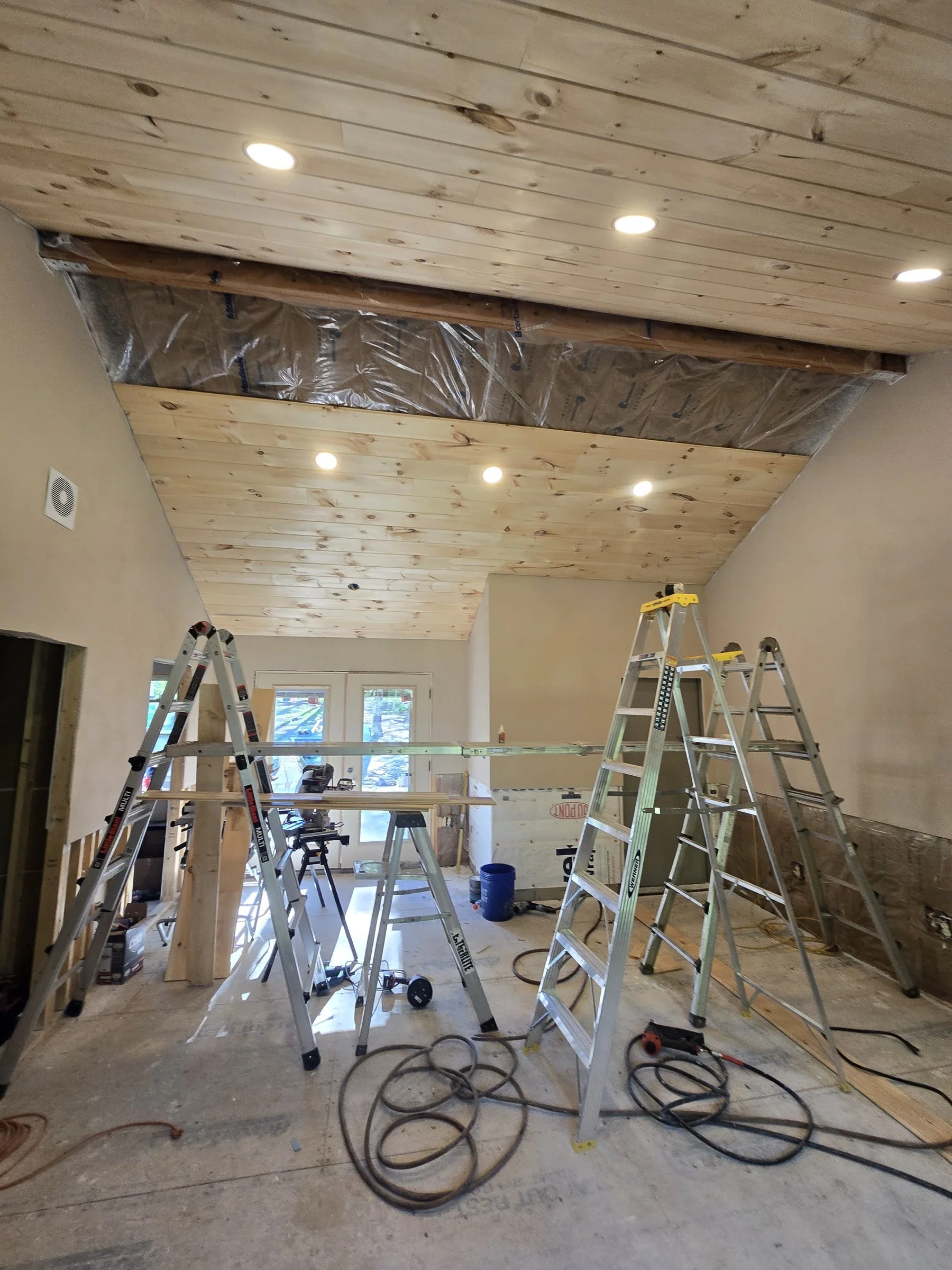 Tongue and groove pine ceiling with recessed lighting