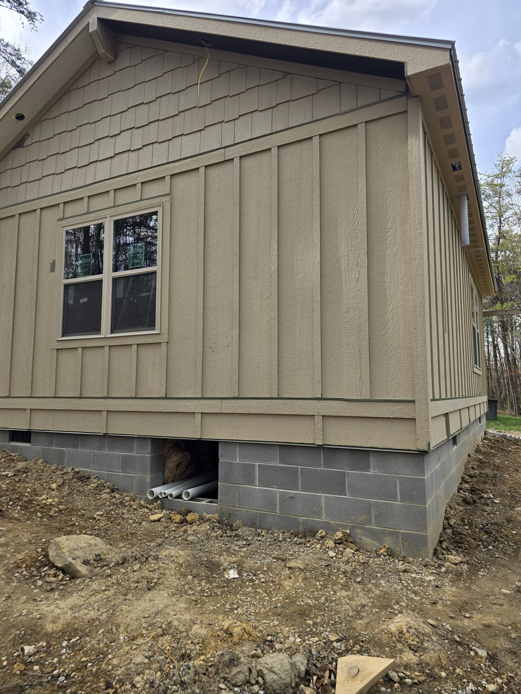 New board and batten siding installed on a Kentucky home