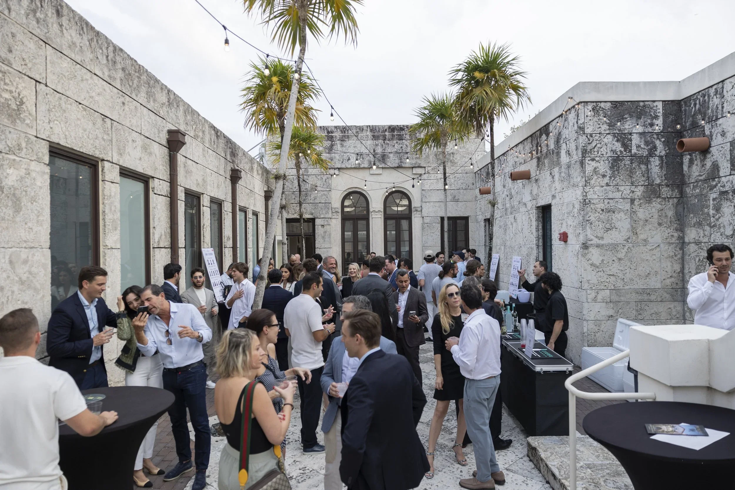 Networking in the Coral Gables Museum courtyard at the third PROFILEmiami Pre-Construction Development Summit.