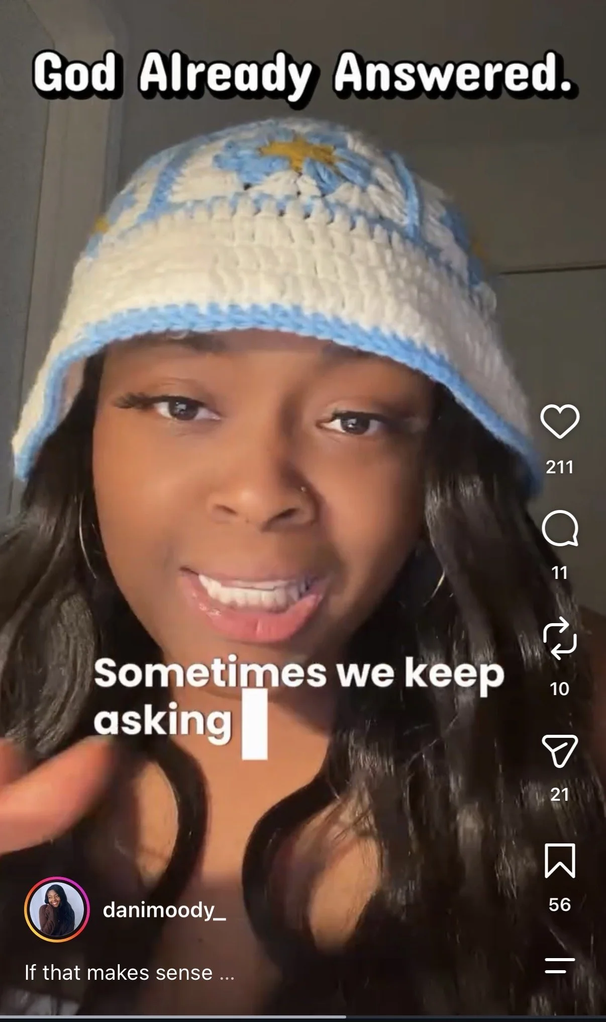 A woman wearing a white and blue knit hat with a yellow emblem appears to be speaking. The image has overlayed text that says, "God Already Answered. Sometimes we keep asking."