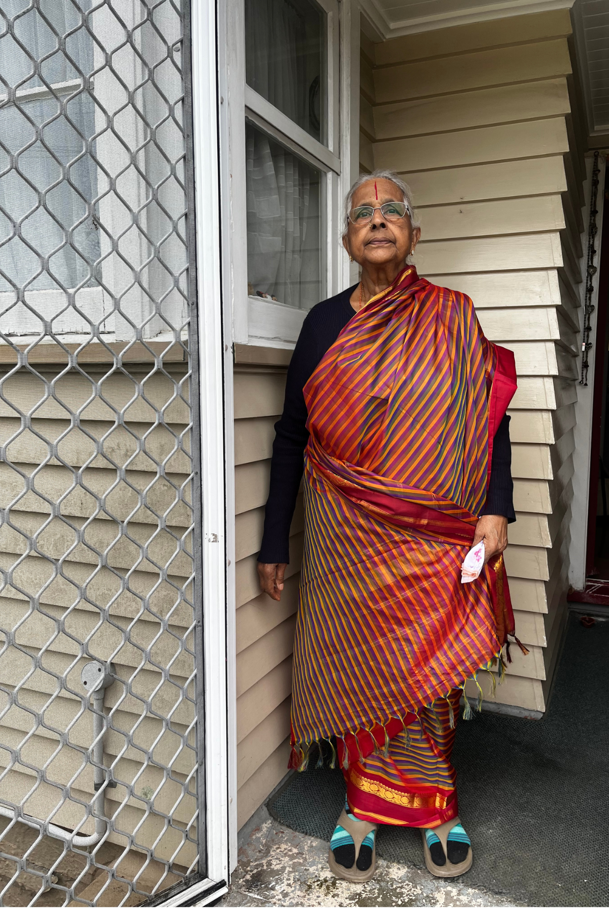 MANZIL 033: PATTI ALL DRESSED UP!

My grandmother comes from a warm climate and she finds the winters here harsh. This was her preparing to head out in her grand sari since she finds it warm enough to do so now.
- Anannya