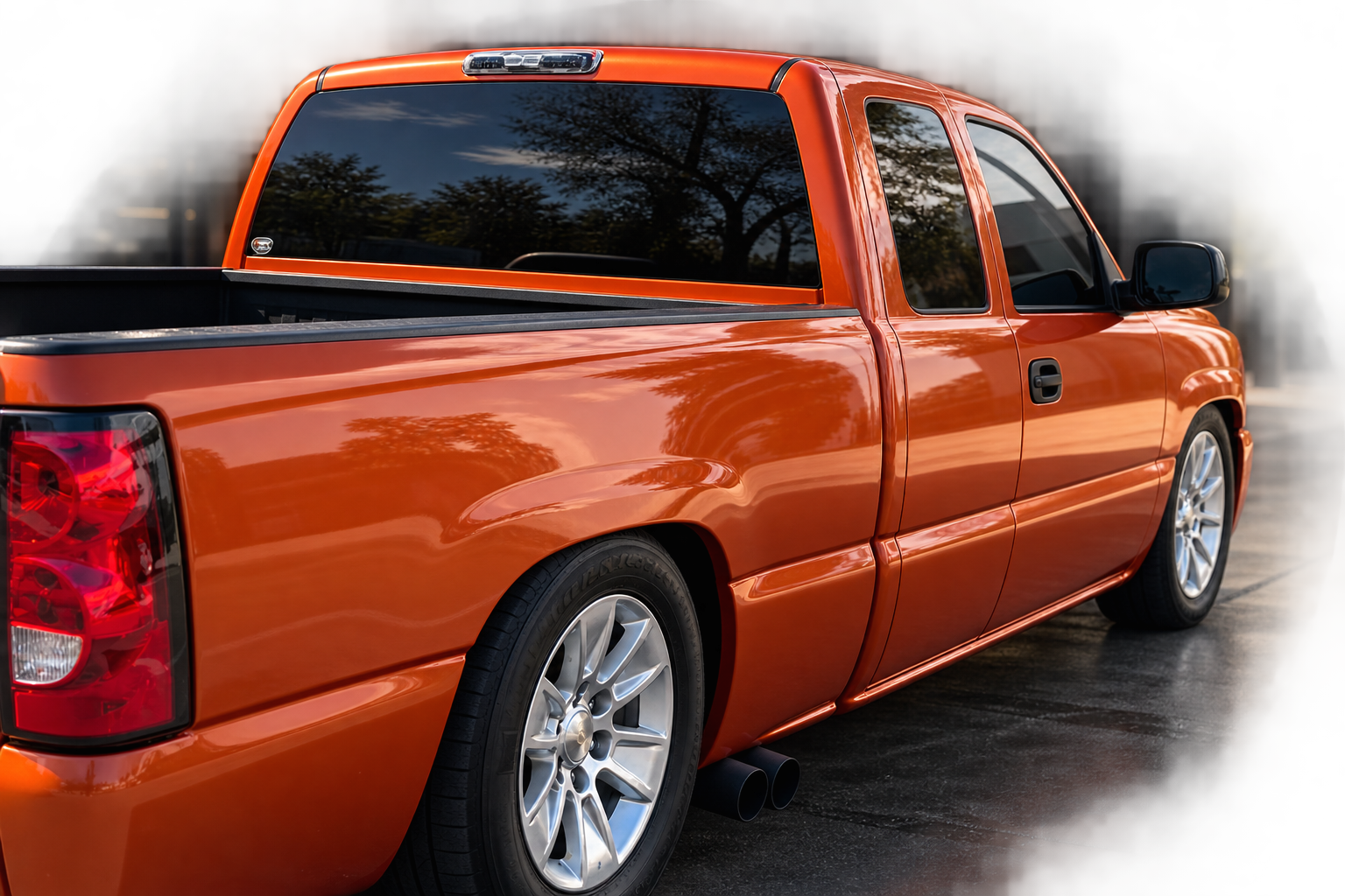 Orange custom pickup truck with tinted windows at Tint Culture in Bakersfield, California