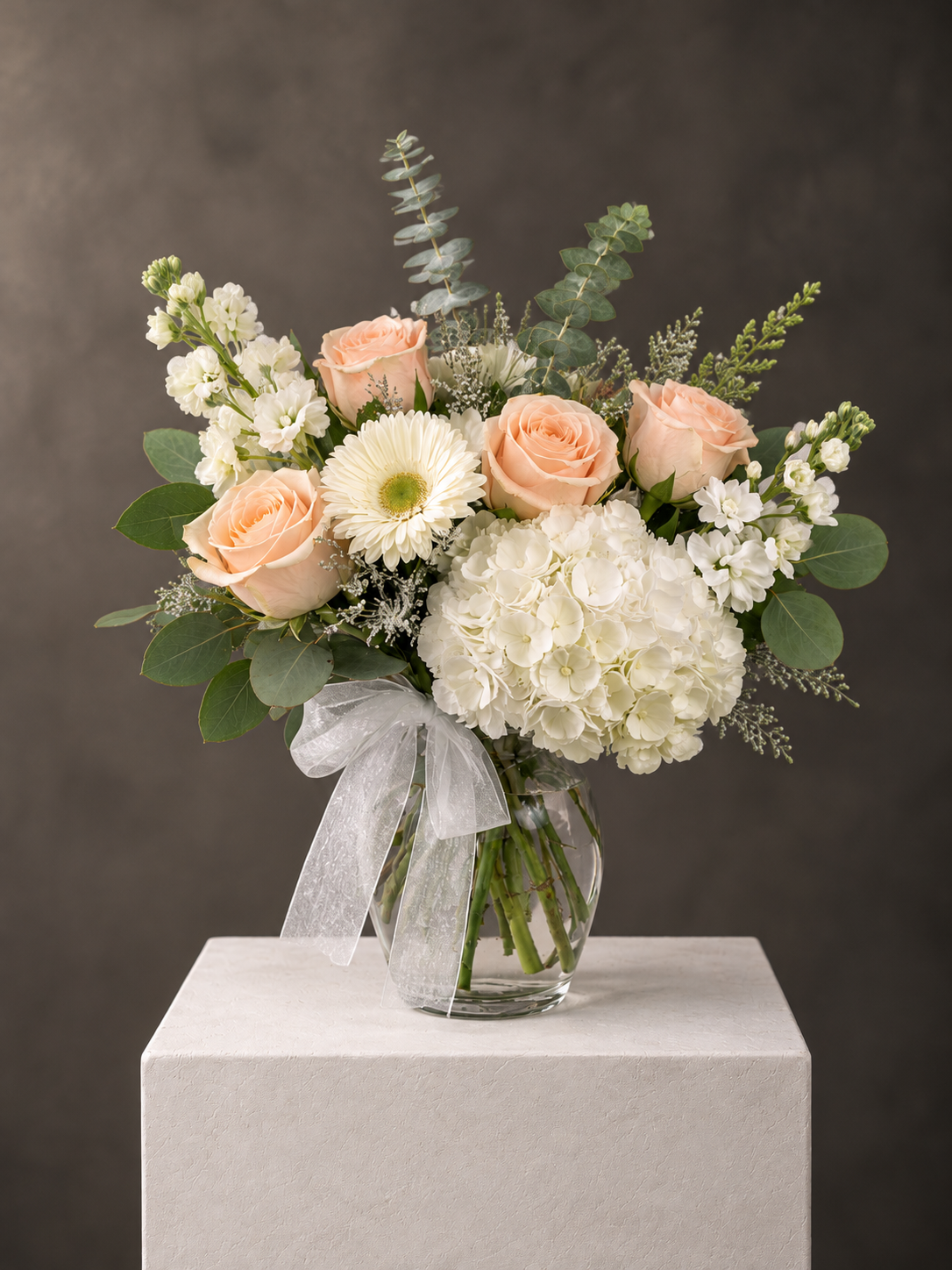 Romantic Pastel Bouquet on Stone Pedestal.png