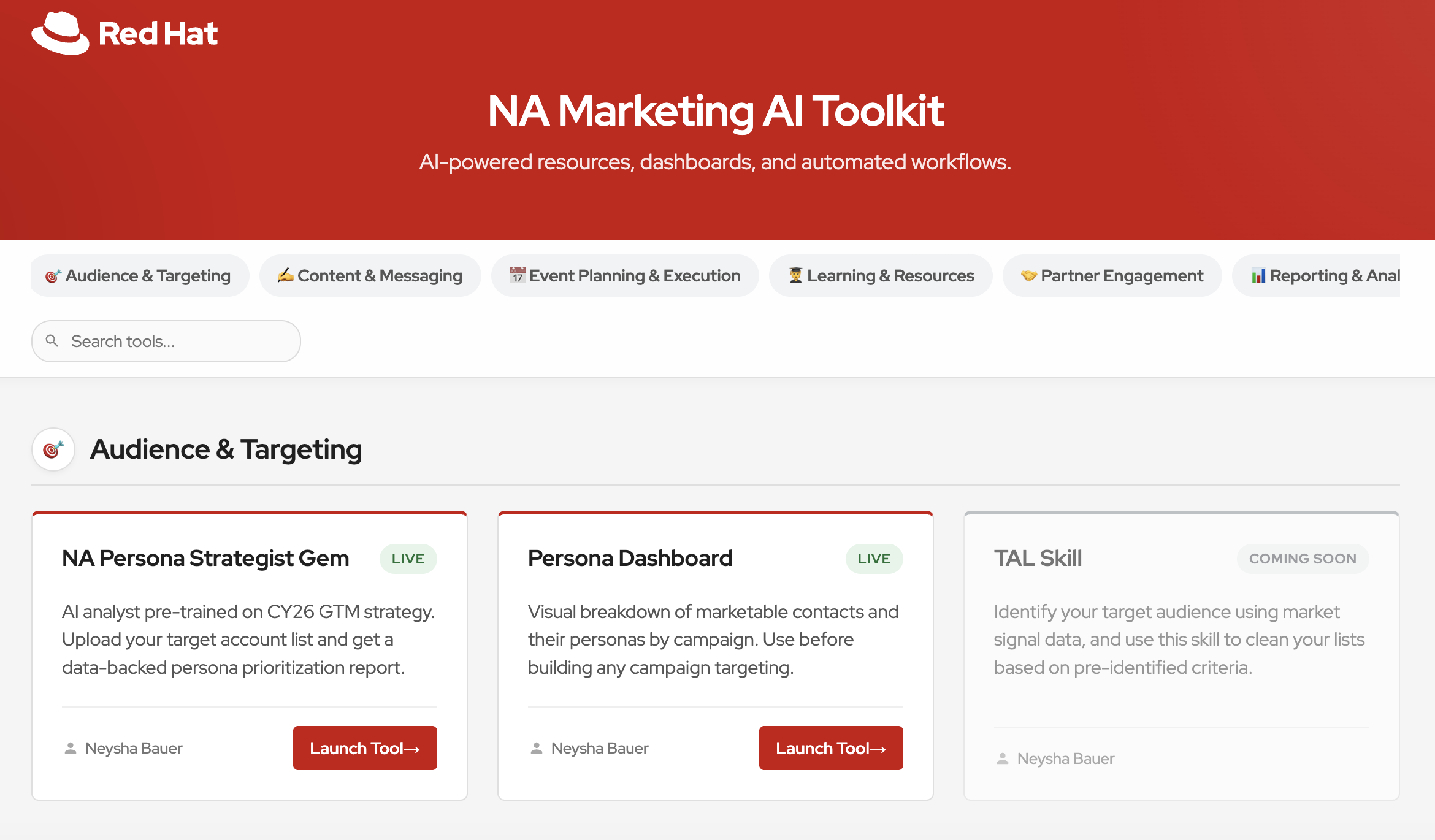Screenshot of a website page titled 'NA Marketing AI Toolkit' with a red header, displaying a logo with a red hat, and navigation options such as Audience & Targeting, Content & Messaging, Event Planning & Execution, Learning & Resources, Partner Engagement, and Reporting & Analytics. Below the header, several sections show AI tools with titles, descriptions, and a red 'Launch Tool' button under each.