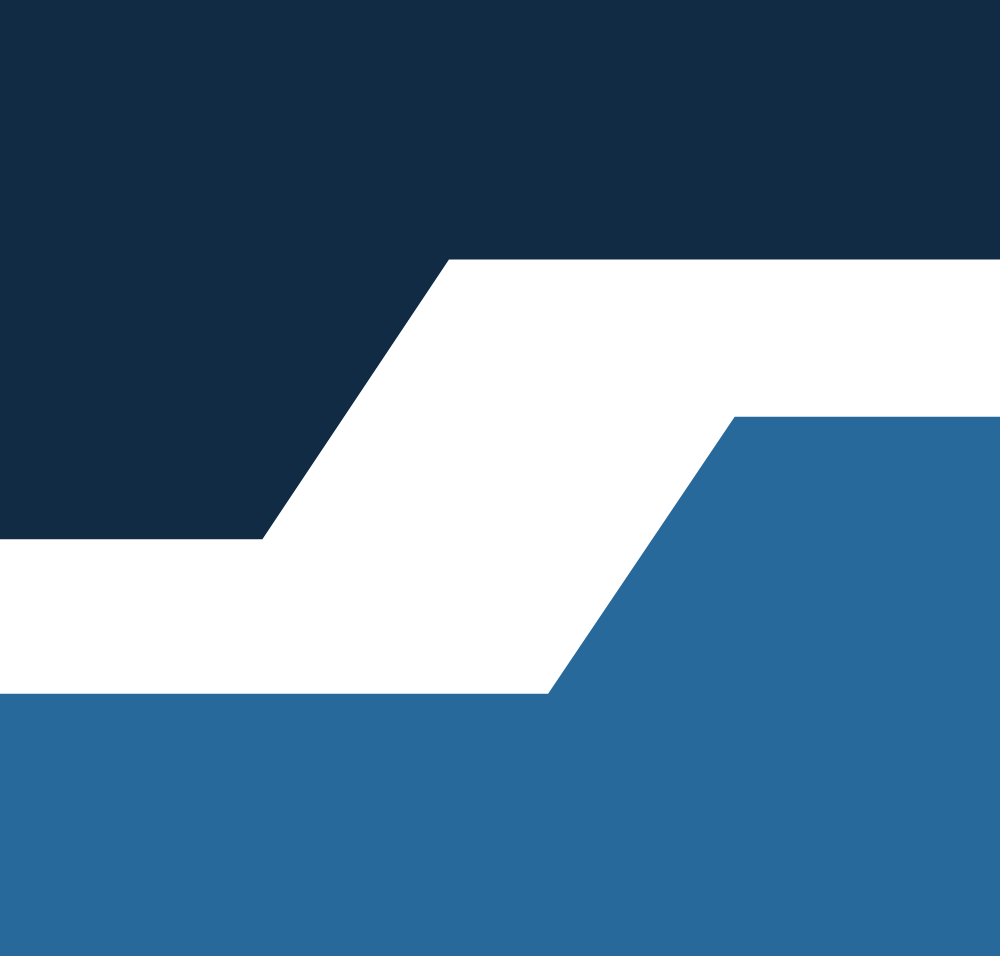 Close-up of black and dark blue geometric logo design on a blue background.
