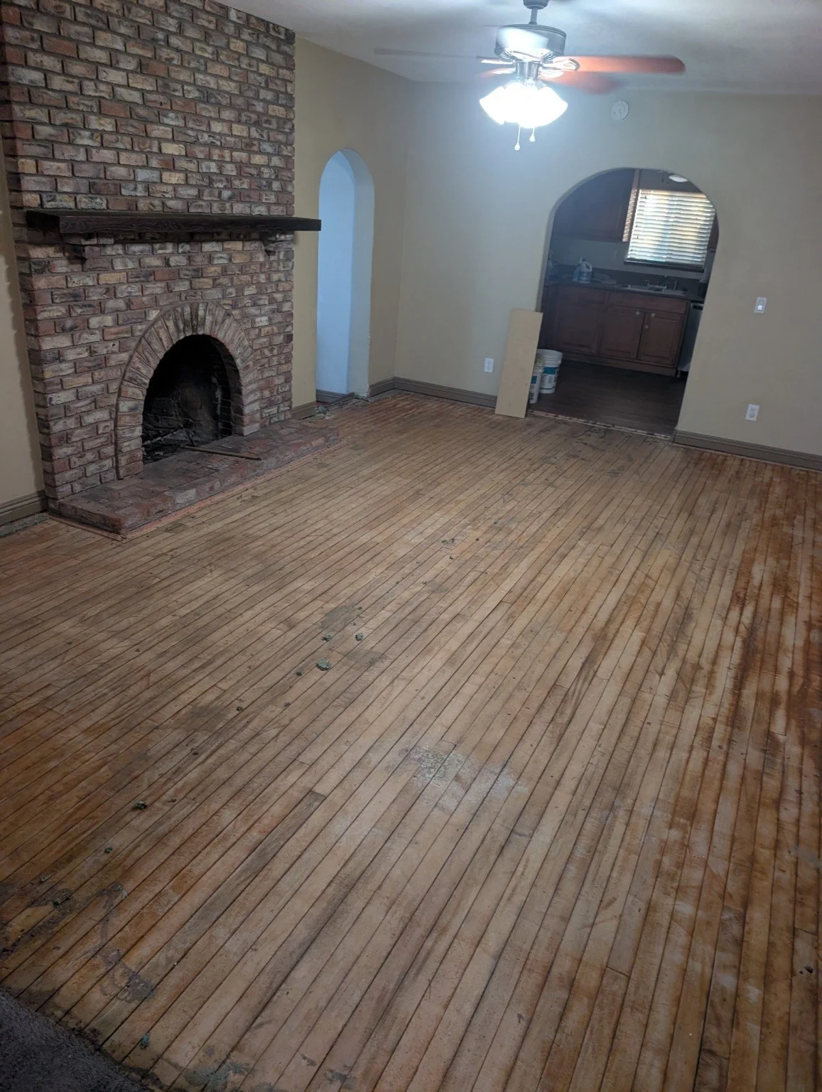 Living-room transformation — before. The original floor prior to installation.