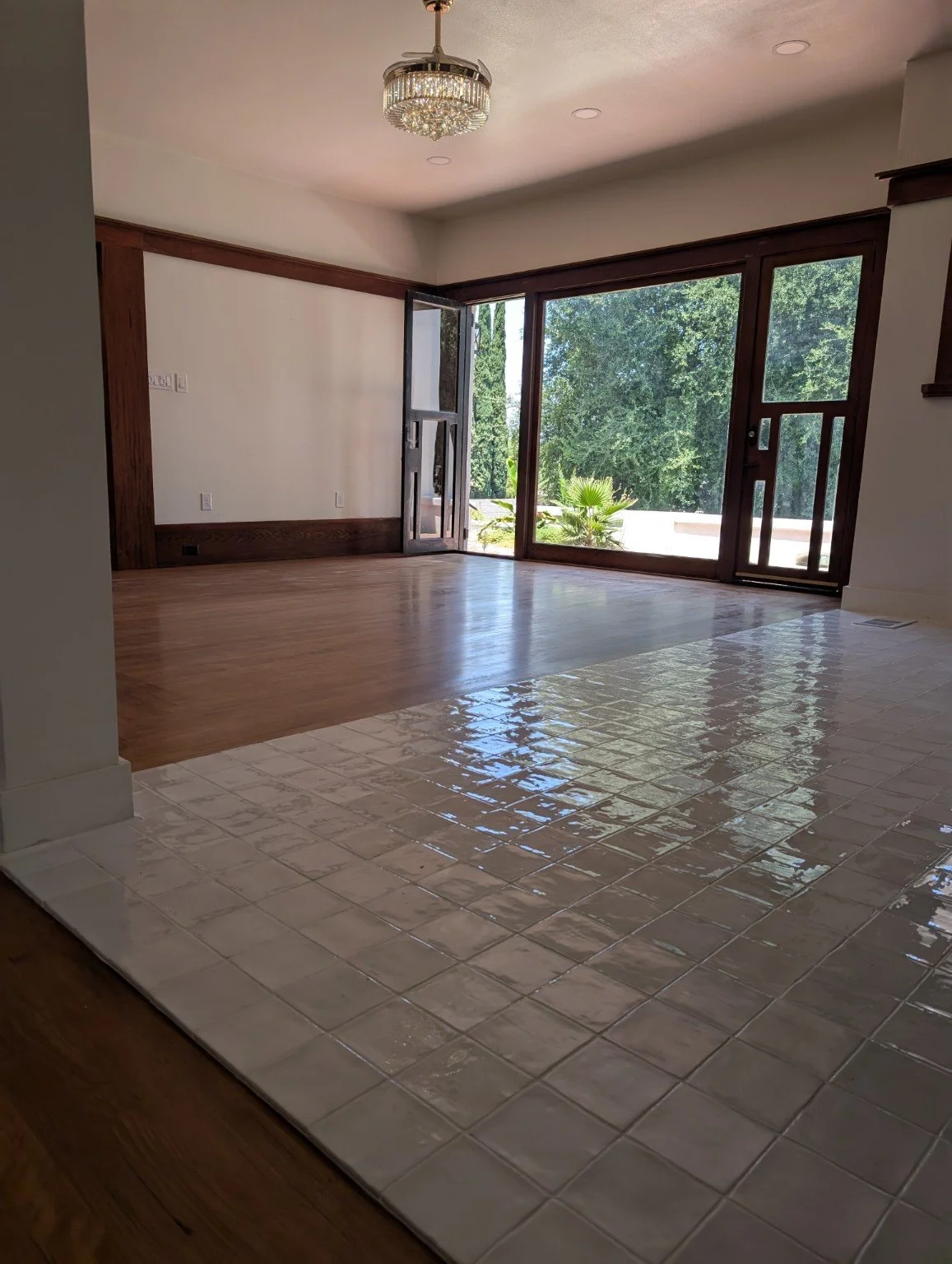 Flooring transition between adjoining rooms.