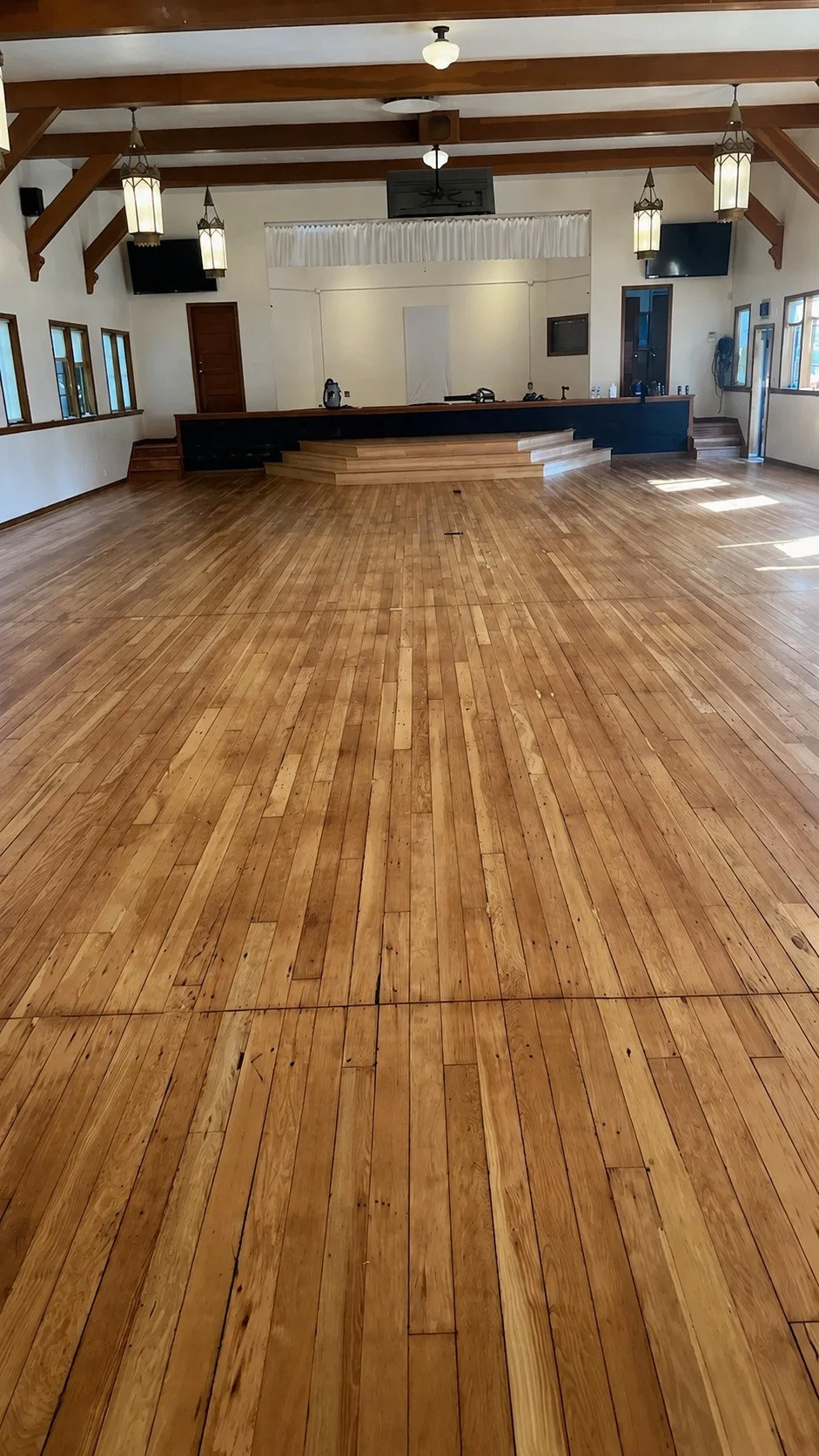 Church hardwood restoration — after sanding and refinishing.