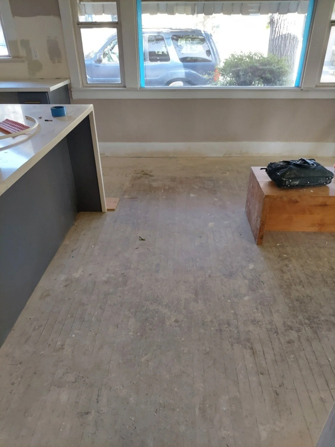 Renovation flooring — before, kitchen view.