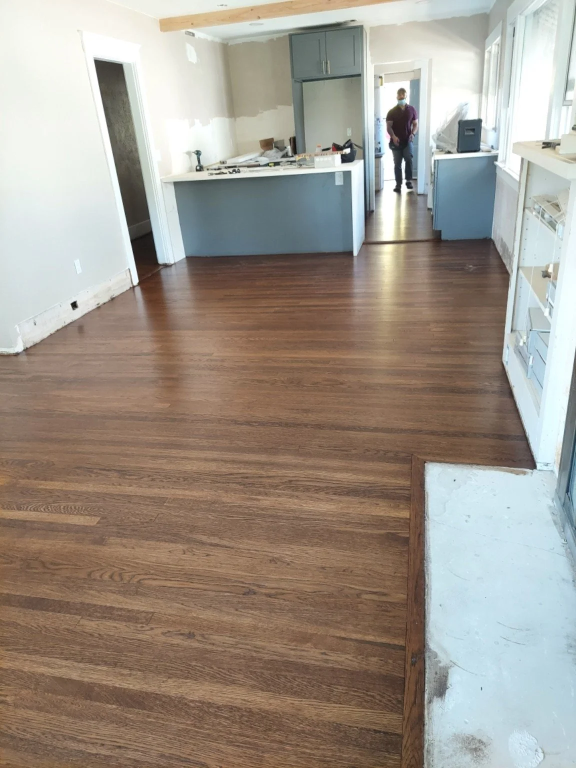 Finished wood flooring in a home kitchen.