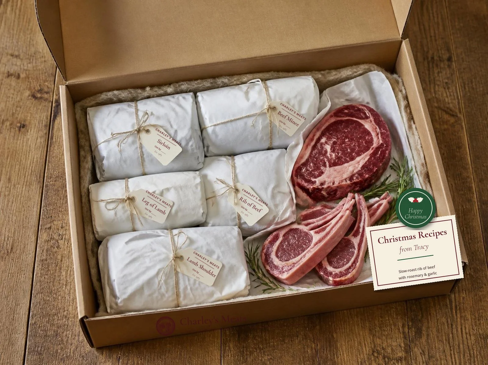 Open kraft box of paper-wrapped meat cuts with raw steaks and lamb chops