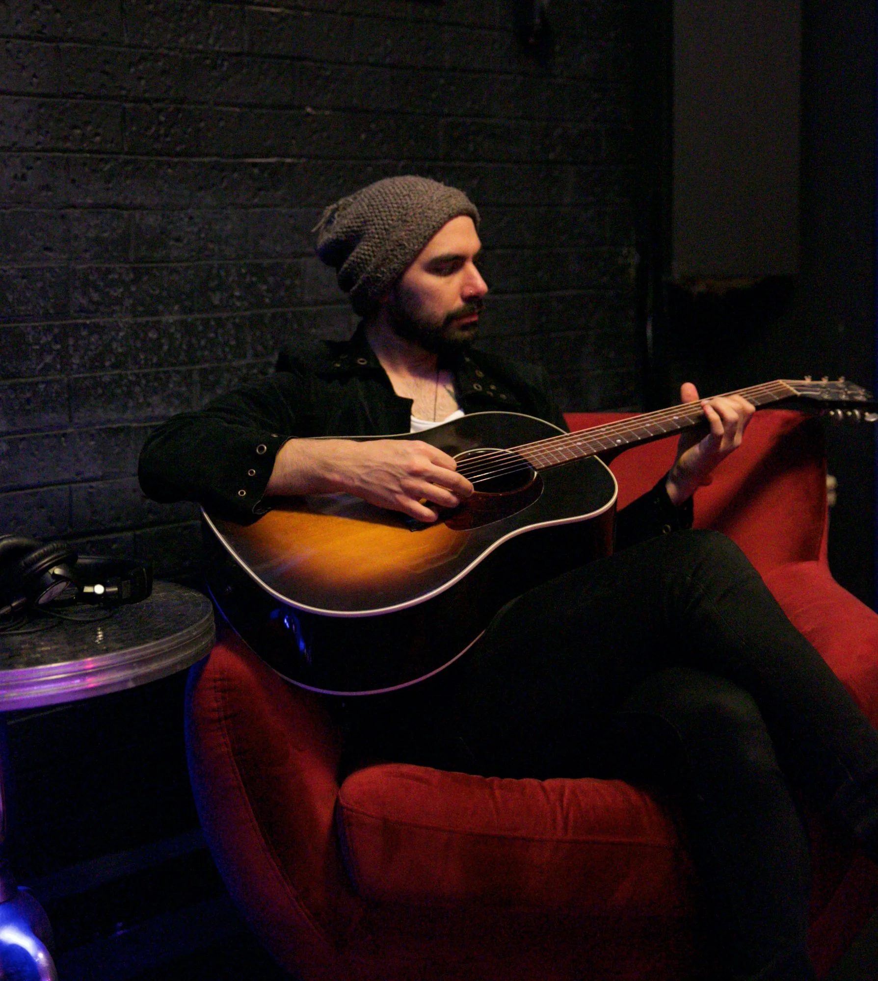 Dan Romeo playing acoustic guitar