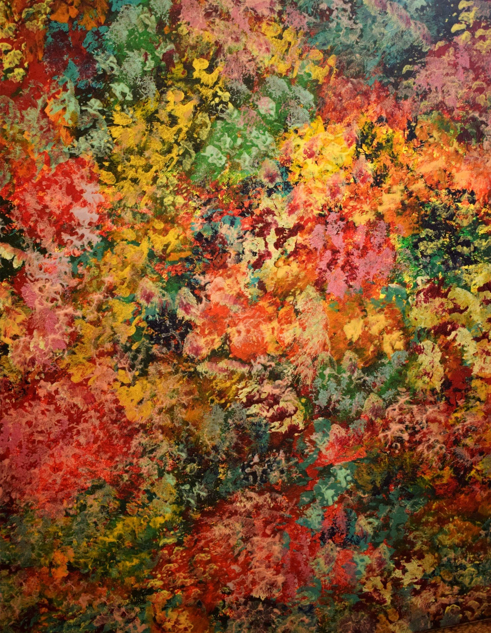 An abstract painting with vibrant, colorful splashes of reds, oranges, yellows, greens, blues, pinks, and blacks, creating a textured mosaic-like appearance.